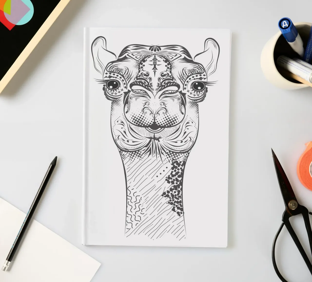 Smiling camel with ornate patterns notebook by NA/MO