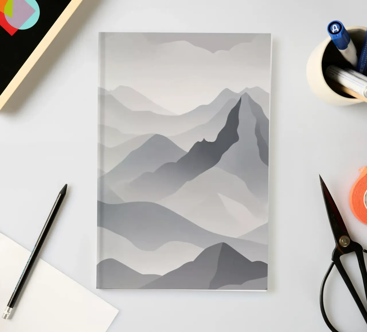 mountain landscape in grayscale showcasing layers of peaks notebook by DesignDoodle
