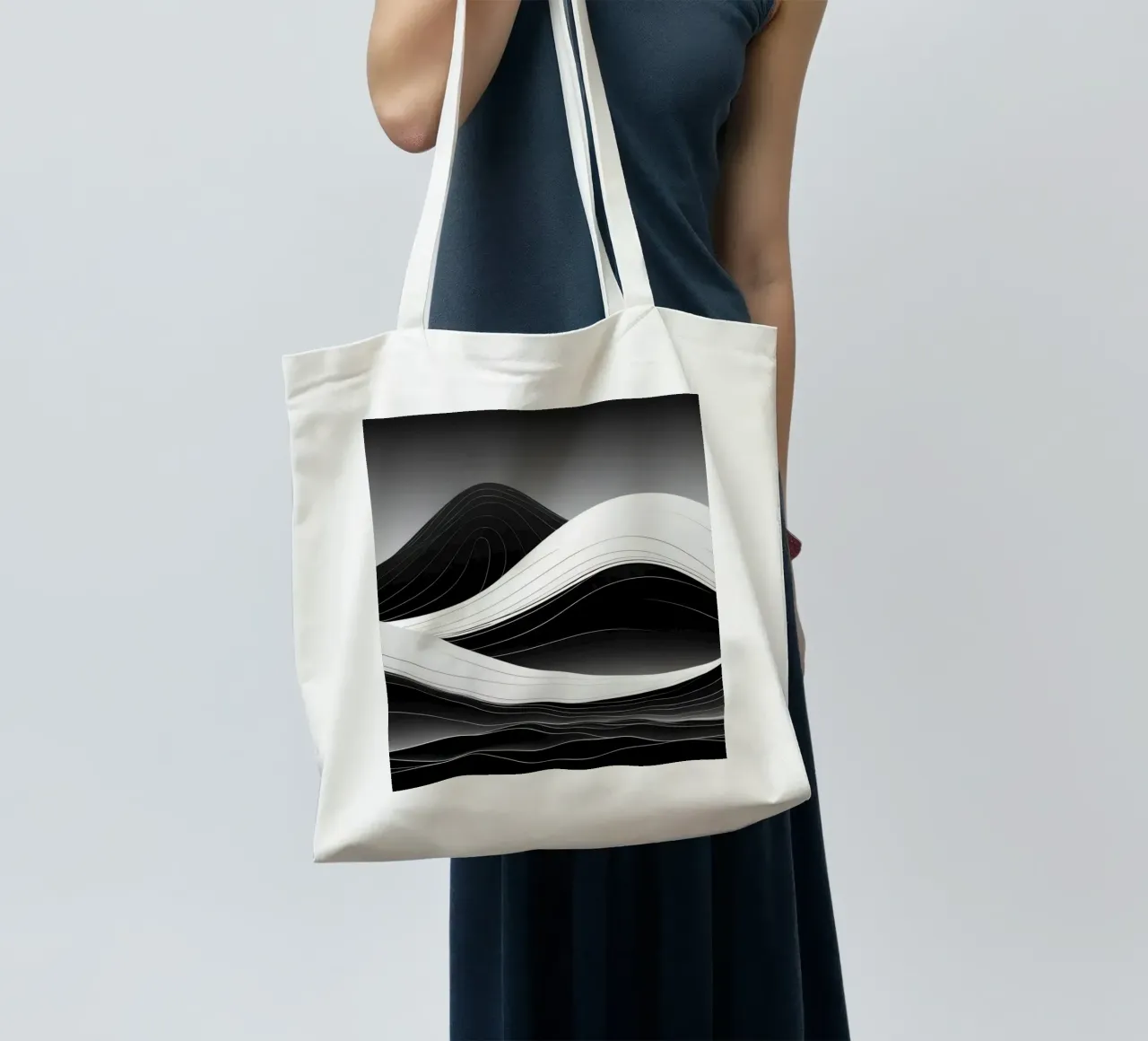 Dynamic black and white waves creating an abstract landscape tote bag by DesignDoodle