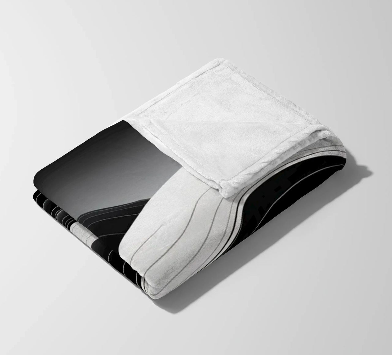 Dynamic black and white waves creating an abstract landscape fleece blanket by DesignDoodle
