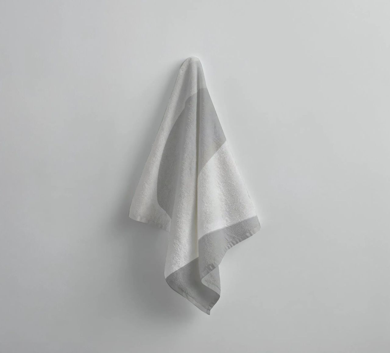 Soft white waves create an abstract composition towel by DesignDoodle