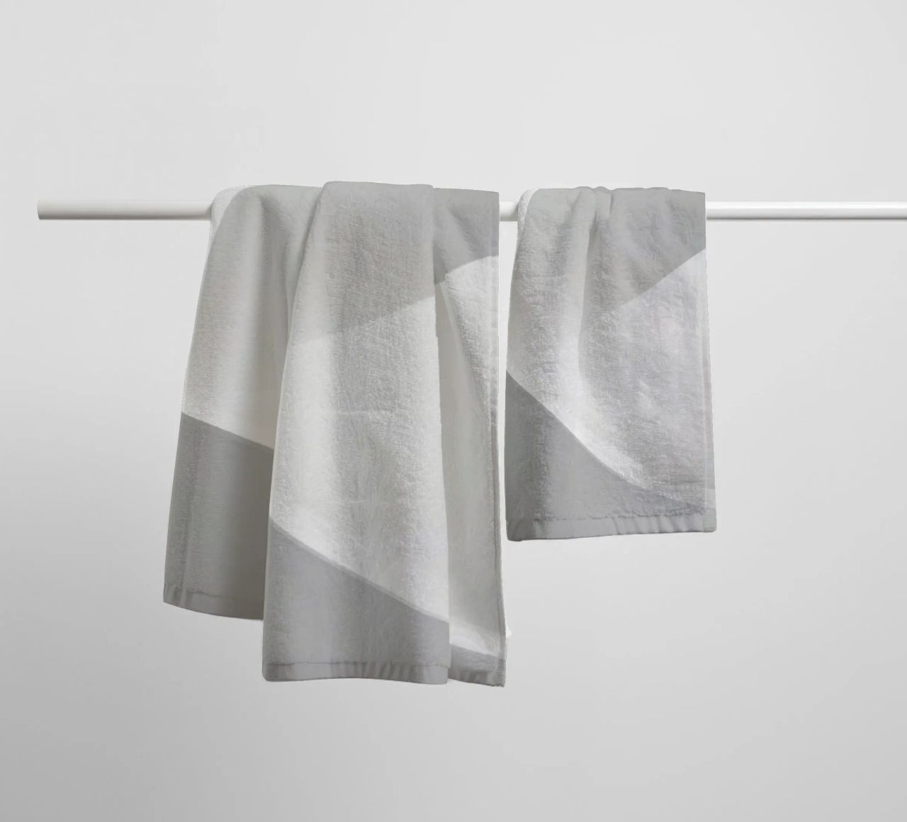 Soft white waves create an abstract composition towel by DesignDoodle