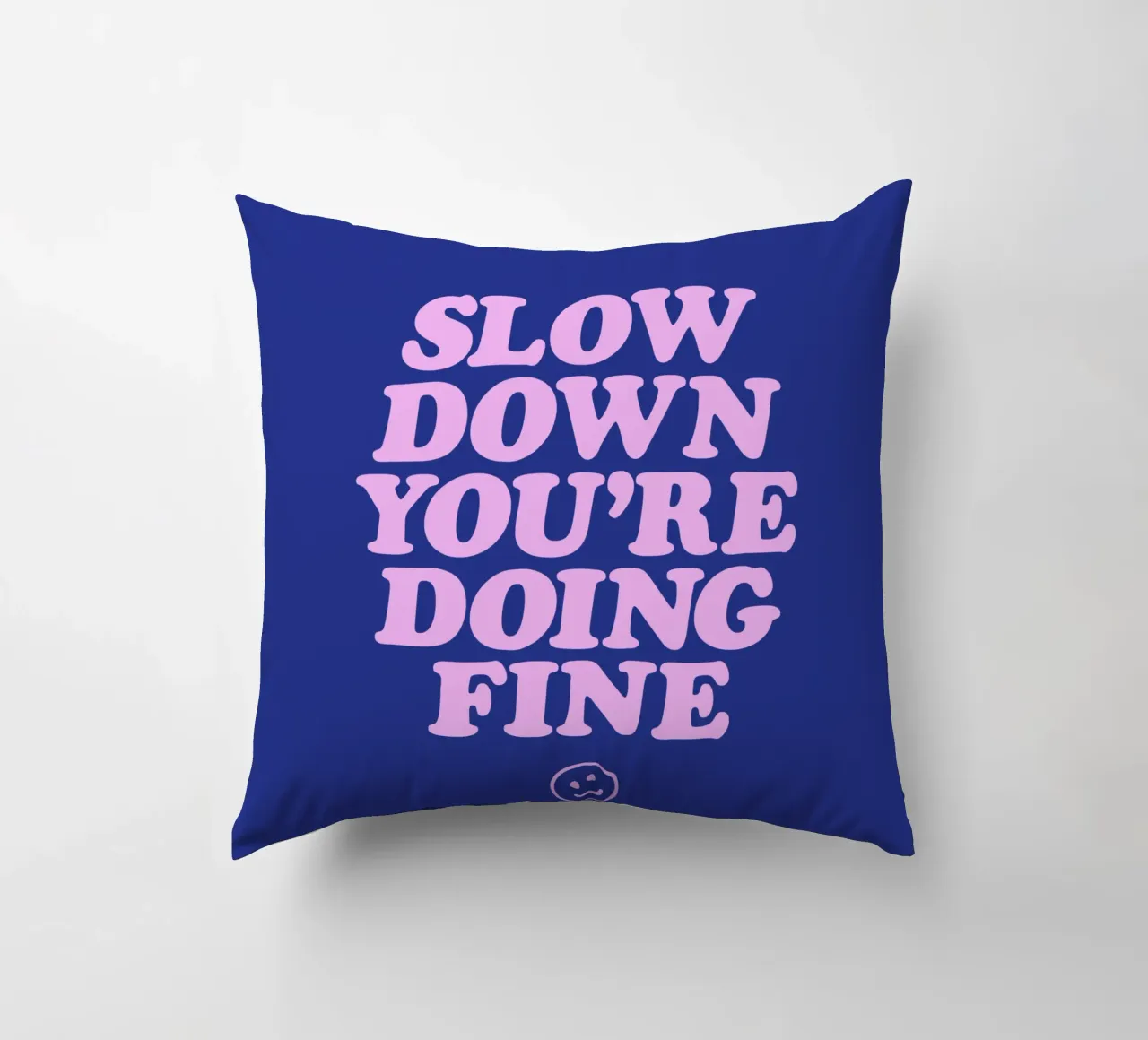 Slow Down You're Doing Fine Typography Print in Pink & Blue decorative cushion by THE MOTIVATED TYPE