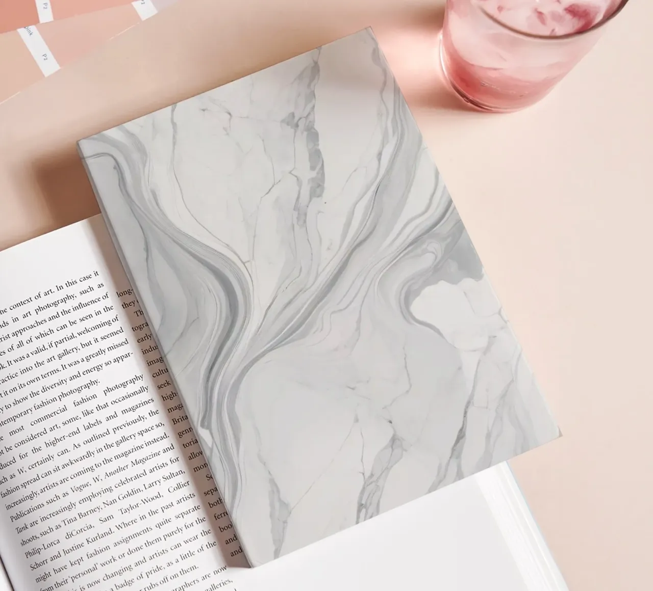 Elegant gray marble texture with swirling patterns and light notebook by DesignDoodle