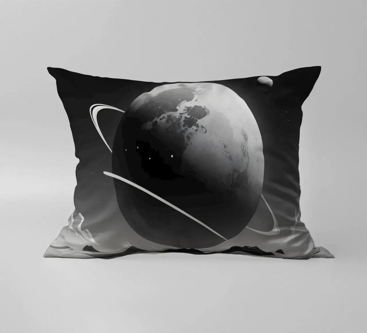 planet with rings hovering over a desolate landscape under a decorative cushion by DesignDoodle