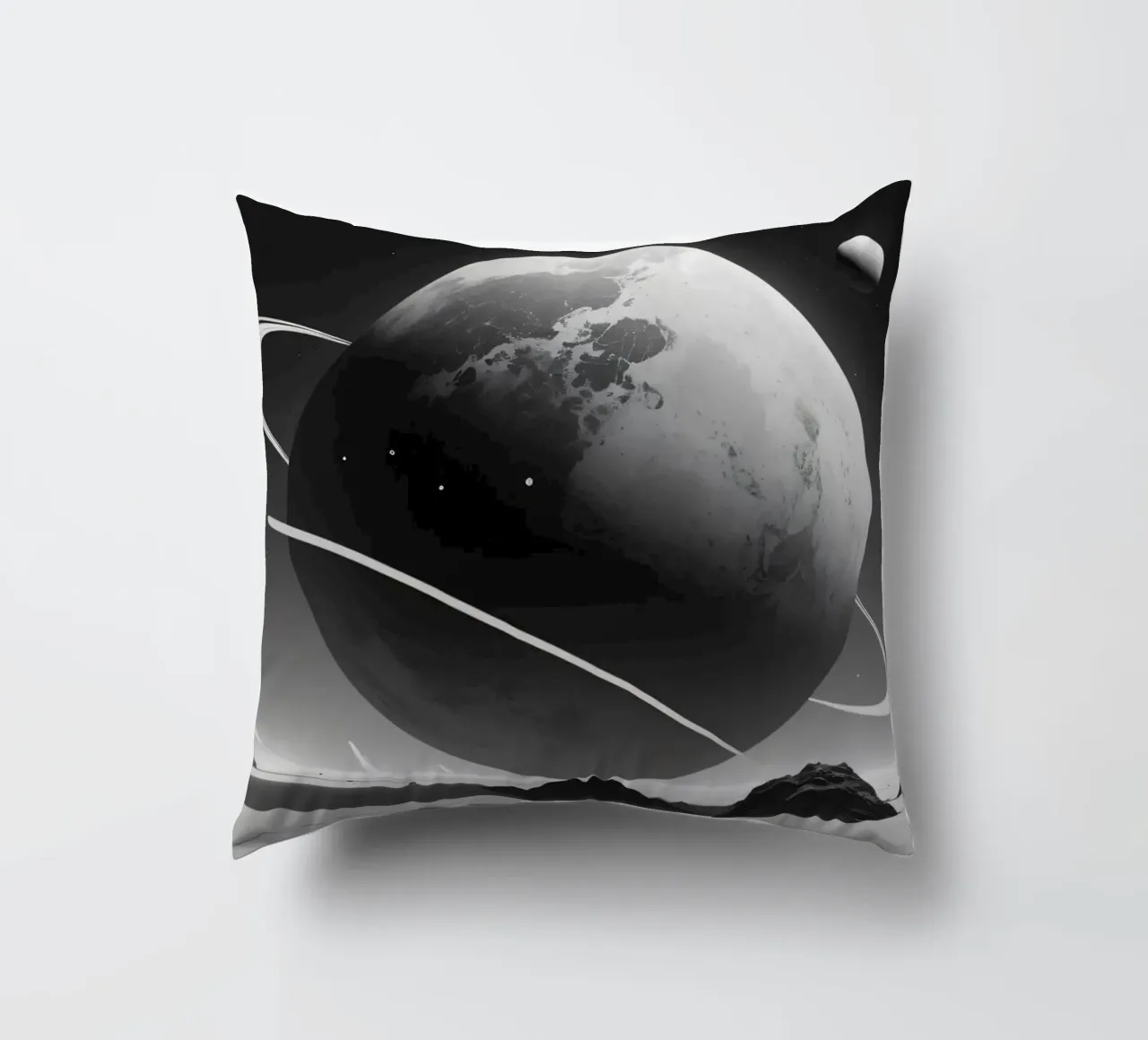 planet with rings hovering over a desolate landscape under a decorative cushion by DesignDoodle