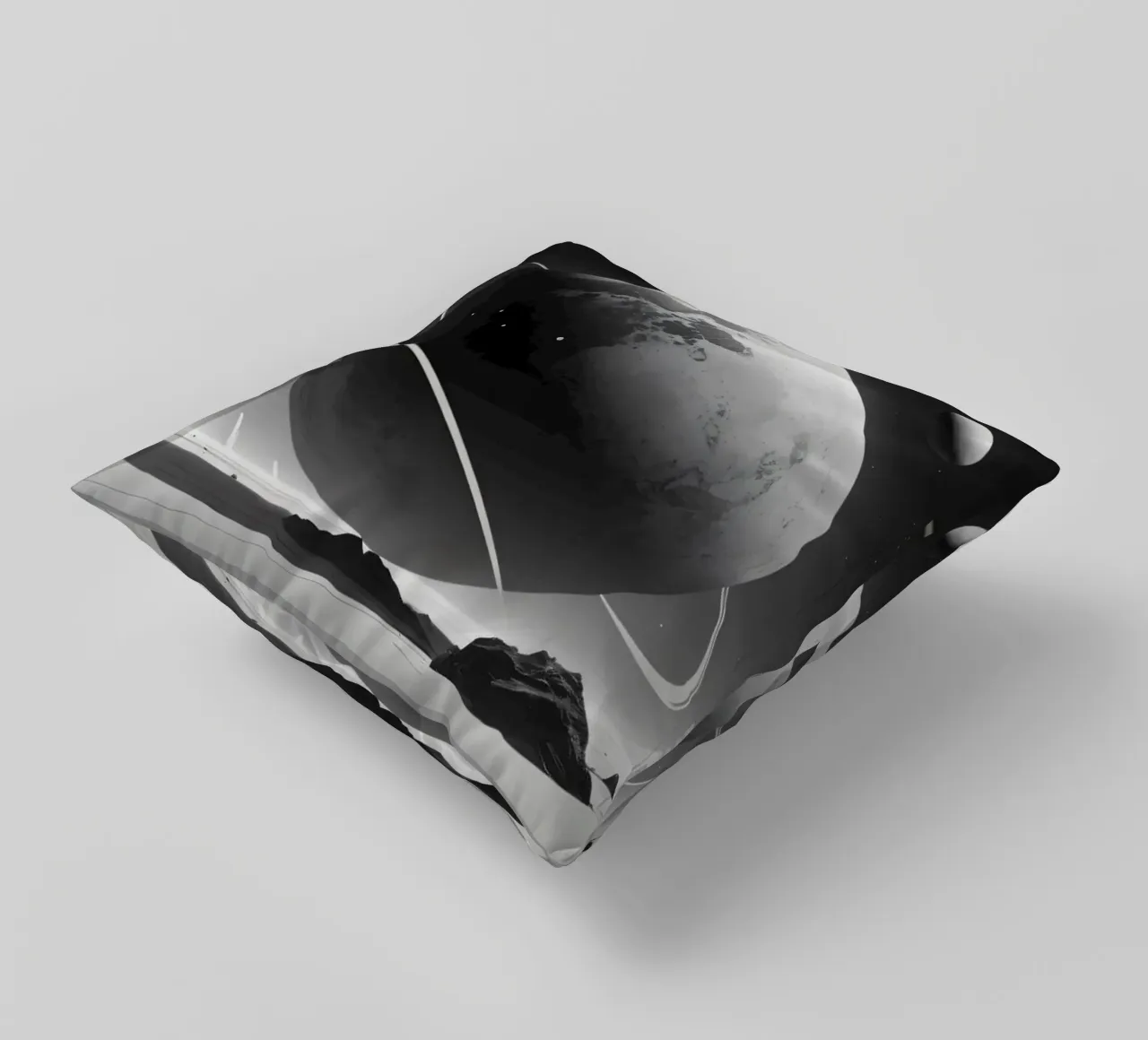 planet with rings hovering over a desolate landscape under a decorative cushion by DesignDoodle