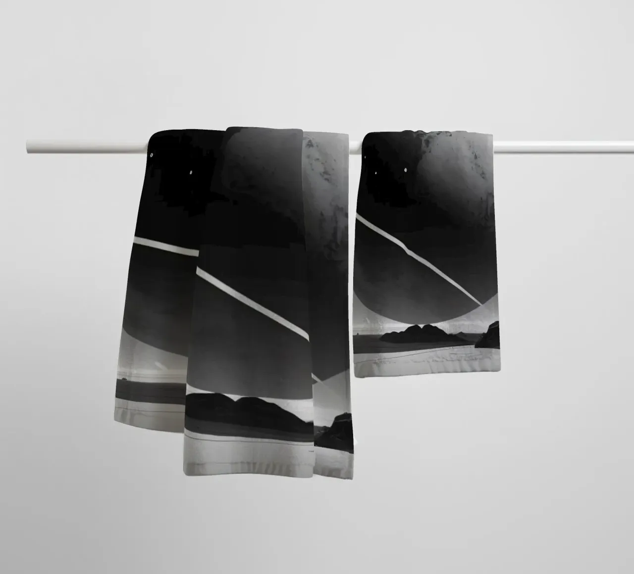 planet with rings hovering over a desolate landscape under a towel by DesignDoodle