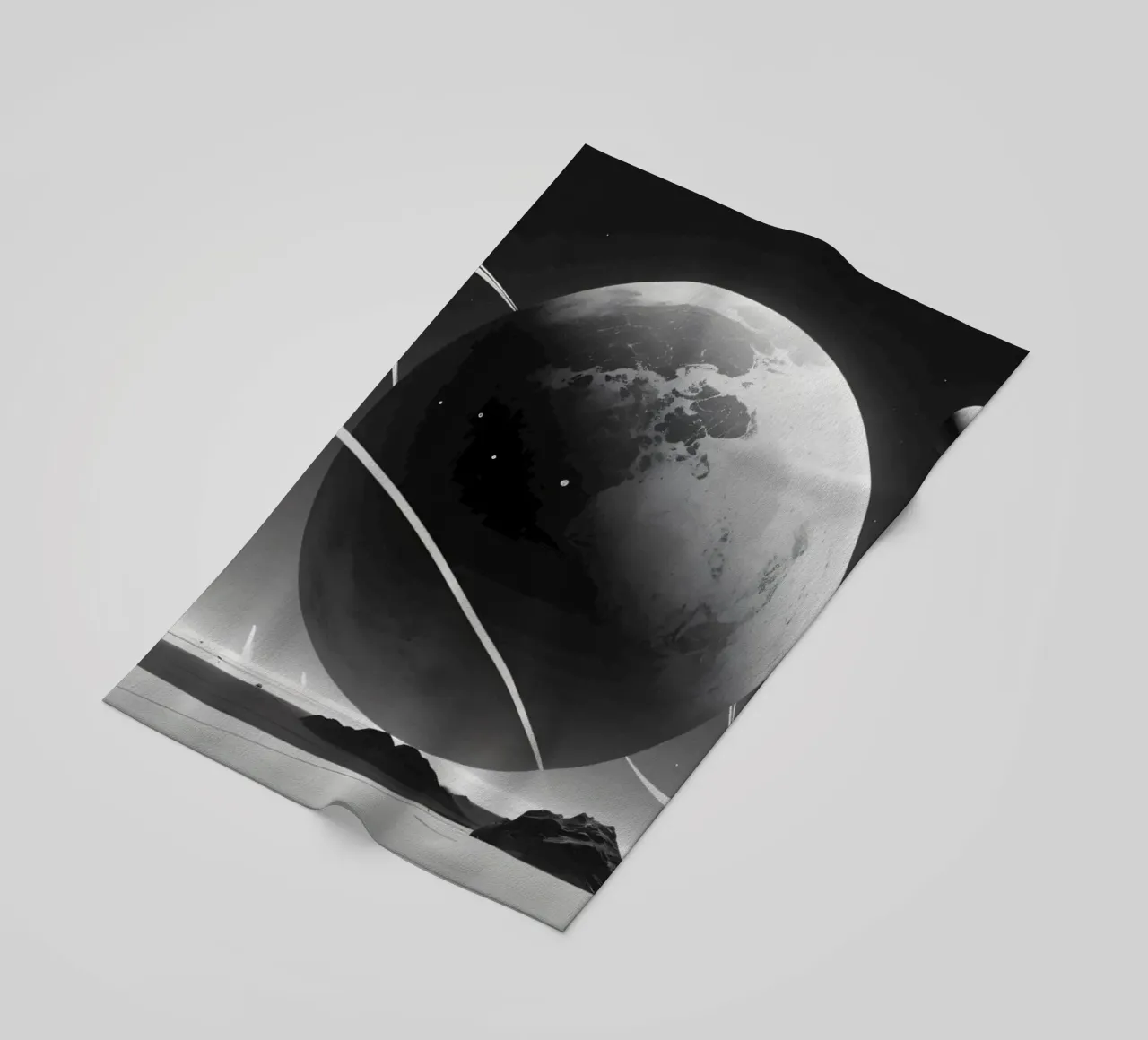 planet with rings hovering over a desolate landscape under a beach towel by DesignDoodle