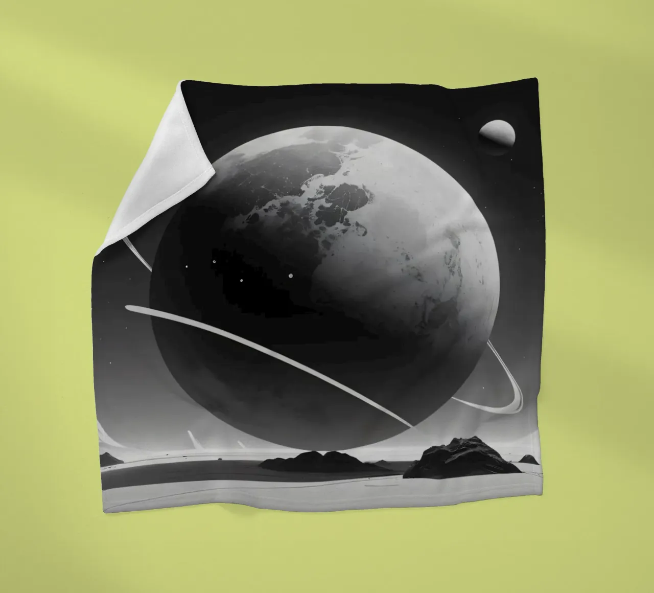 planet with rings hovering over a desolate landscape under a fleece blanket by DesignDoodle