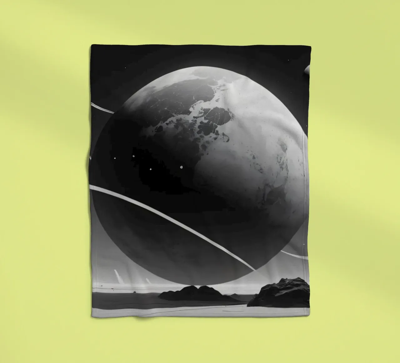 planet with rings hovering over a desolate landscape under a fleece blanket by DesignDoodle