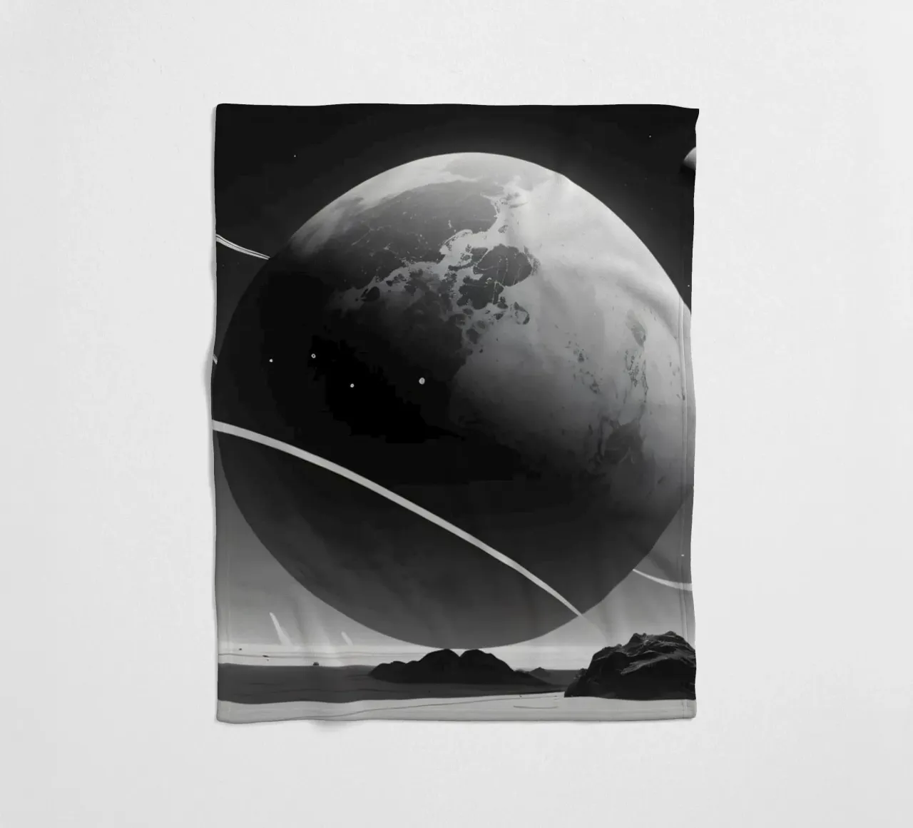 planet with rings hovering over a desolate landscape under a fleece blanket by DesignDoodle