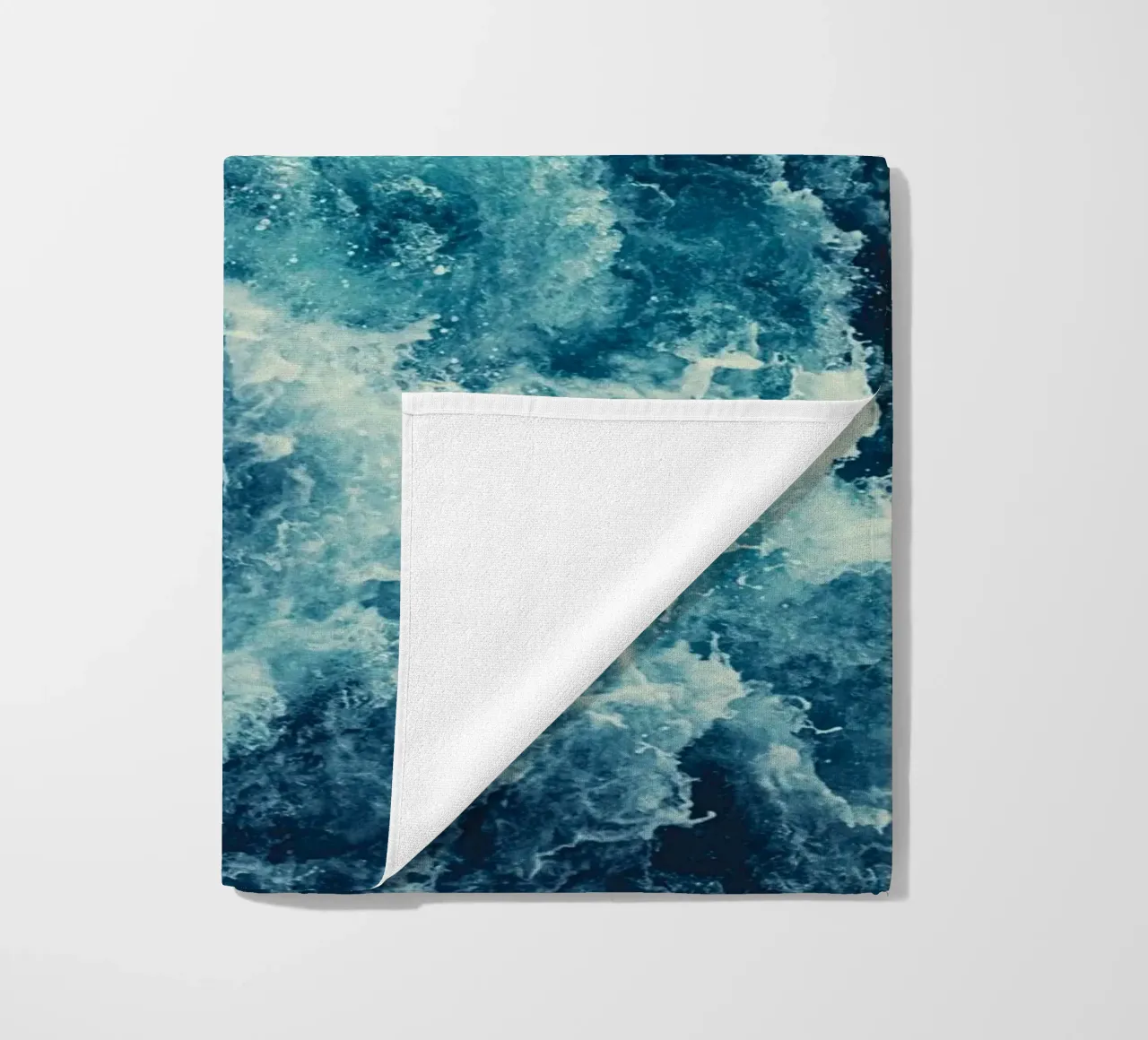 Blue chaos beach towel by BLICKPUNKT