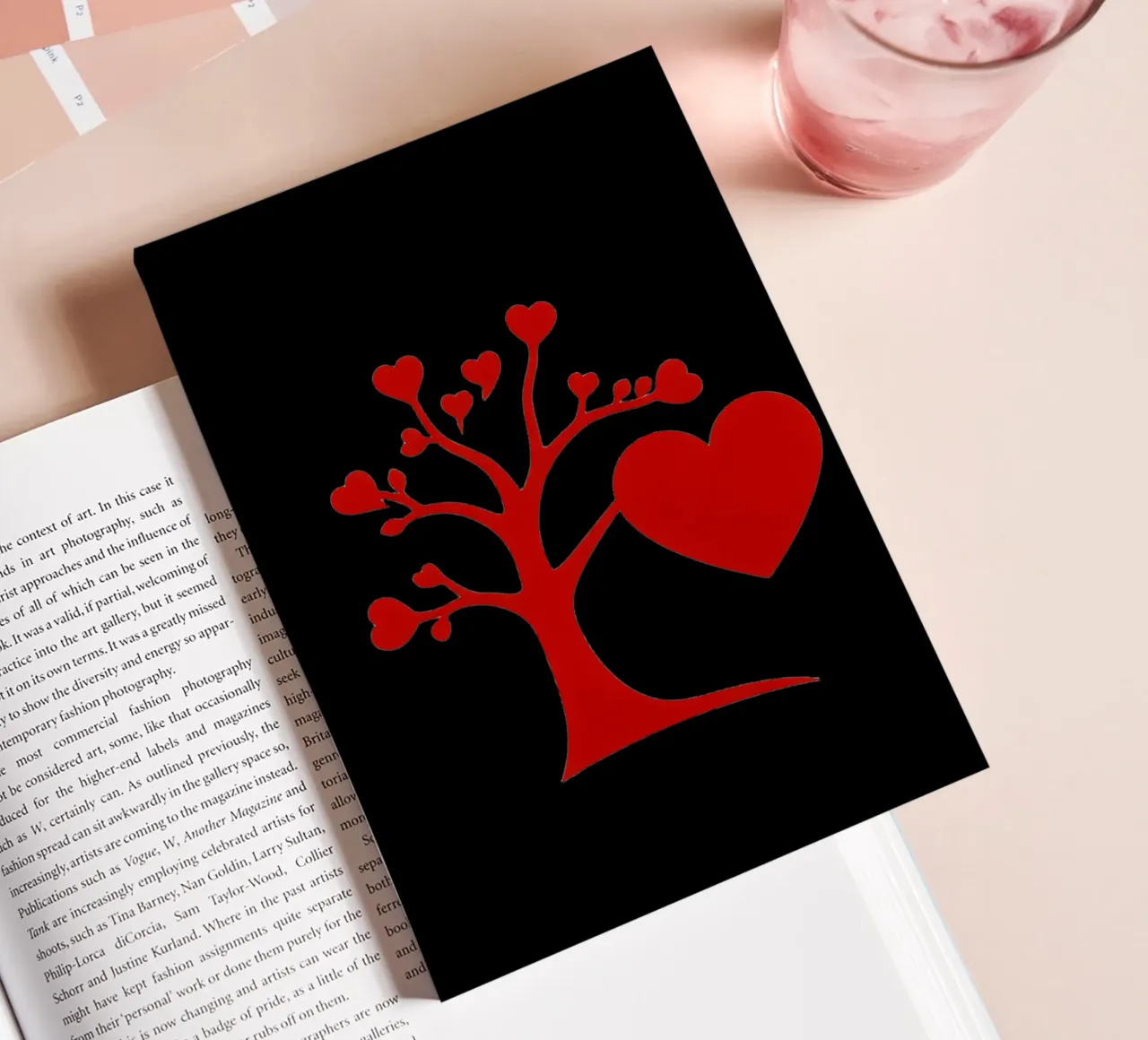 A vibrant red tree adorned with hearts symbolizes love notebook by DesignDoodle