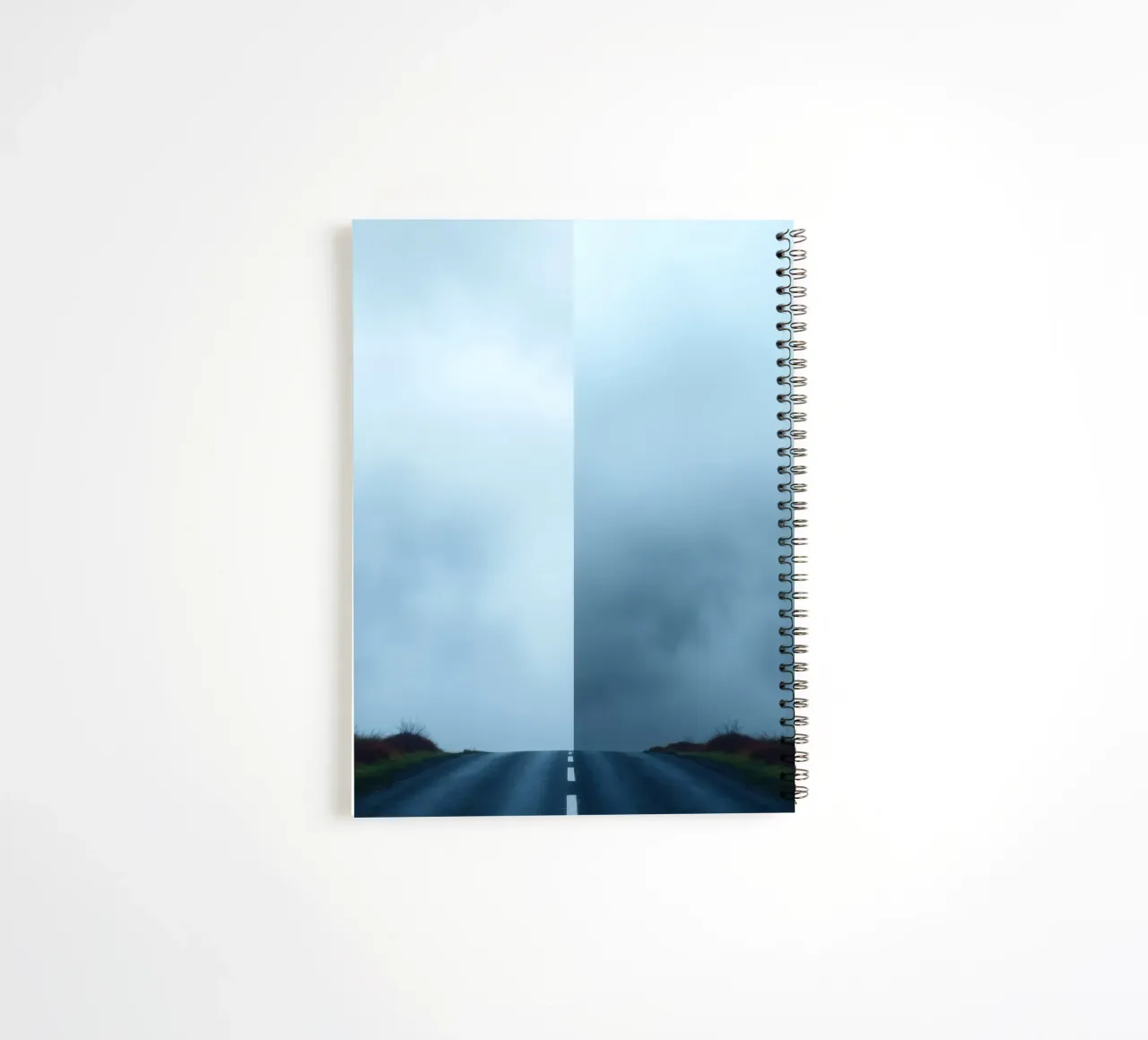 road leads into foggy distance with greenery on both sides spiral notebook by DesignDoodle