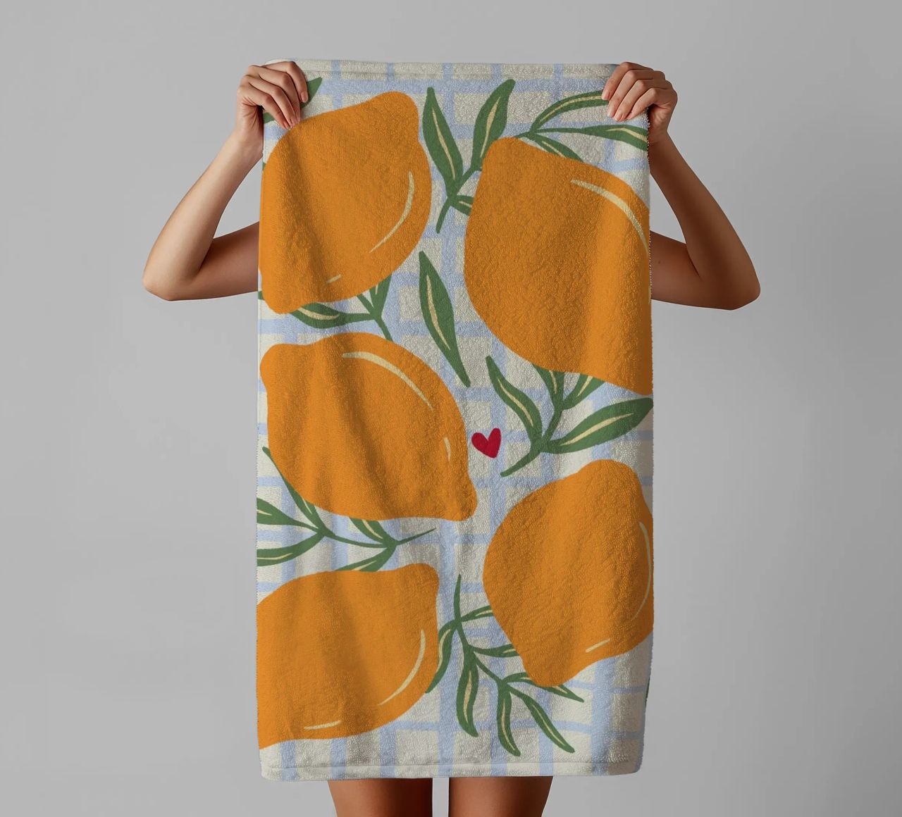 Lemons on a grid pattern towel by Wackapacka