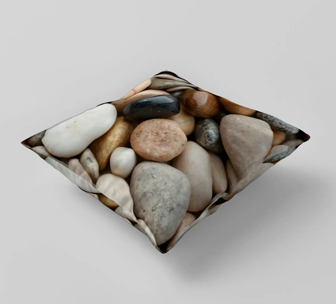 Collezione di pietre di fiume lisce di vari colori e dimensioni cuscino da DesignDoodle