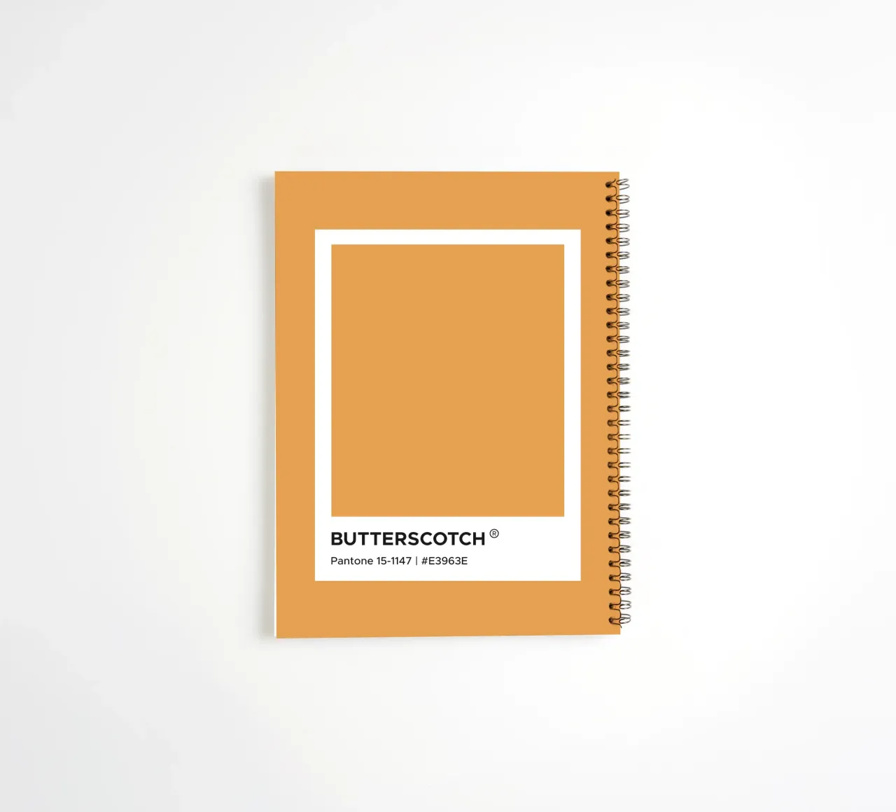 Butterscotch Pantone spiral notebook by Paigaam Studio