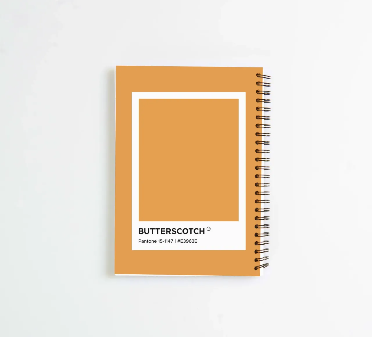 Butterscotch Pantone spiral notebook by Paigaam Studio