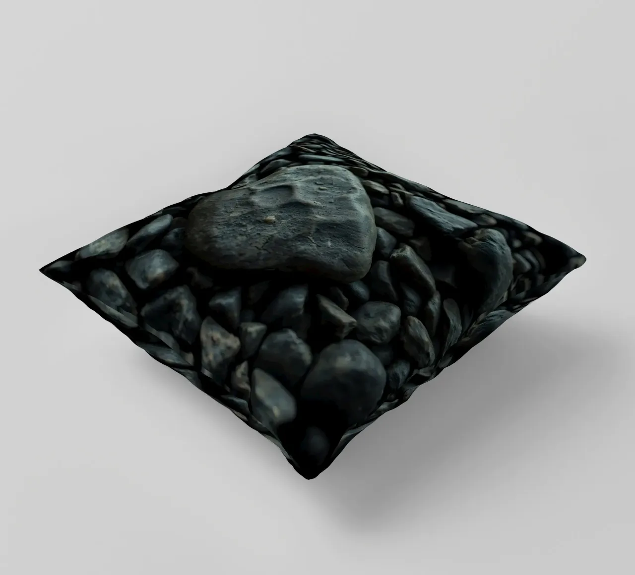 Pietre scure sparse su una spiaggia al tramonto cuscino da DesignDoodle