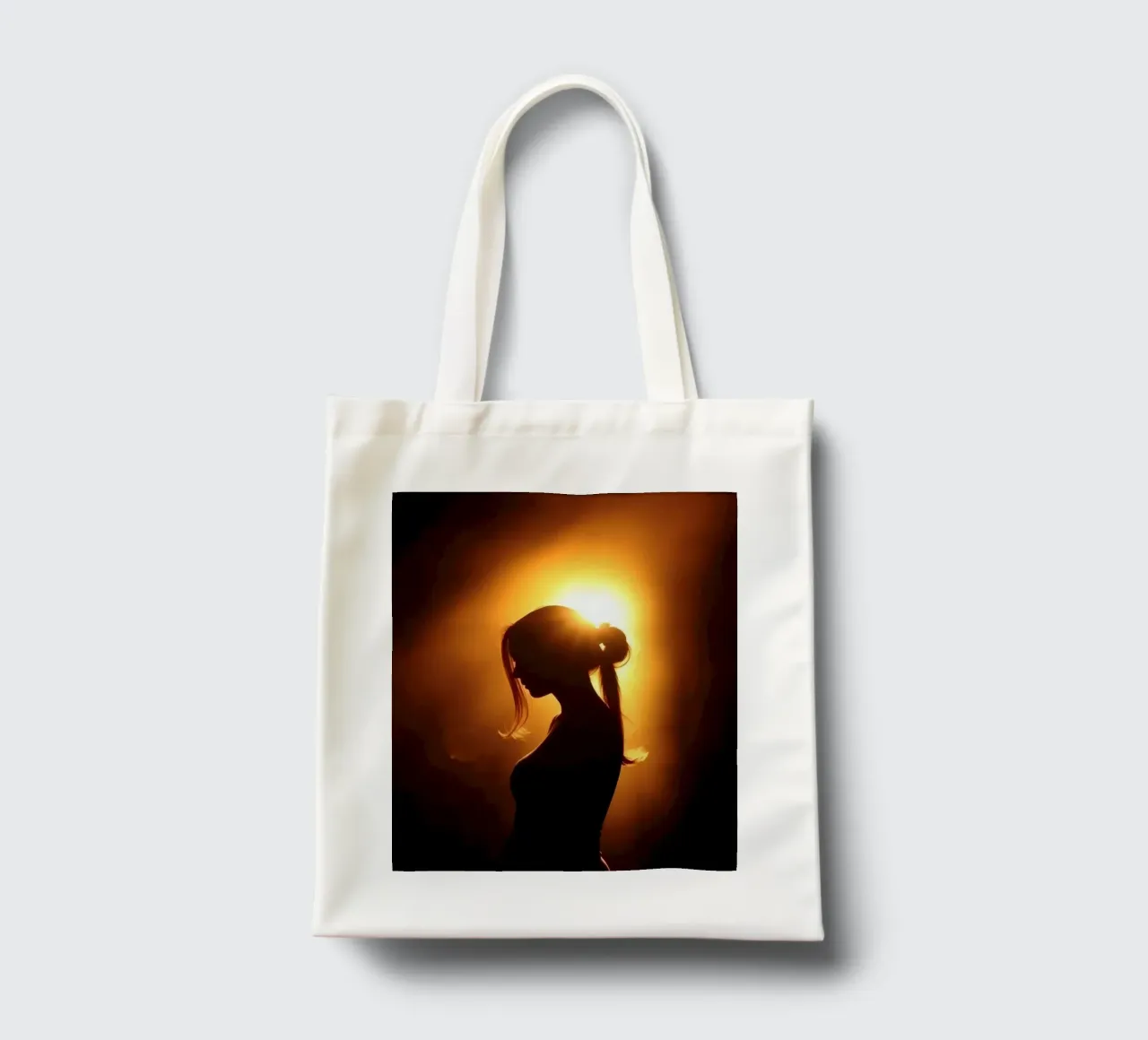 Silhouette of a woman against a warm glowing backdrop tote bag by DesignDoodle