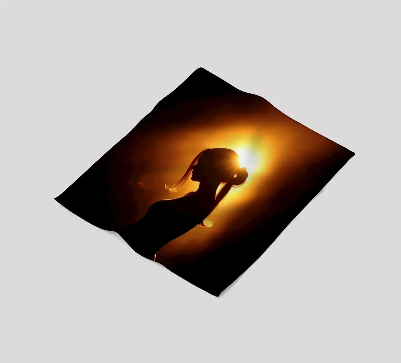Silhouette of a woman against a warm glowing backdrop fleece blanket by DesignDoodle