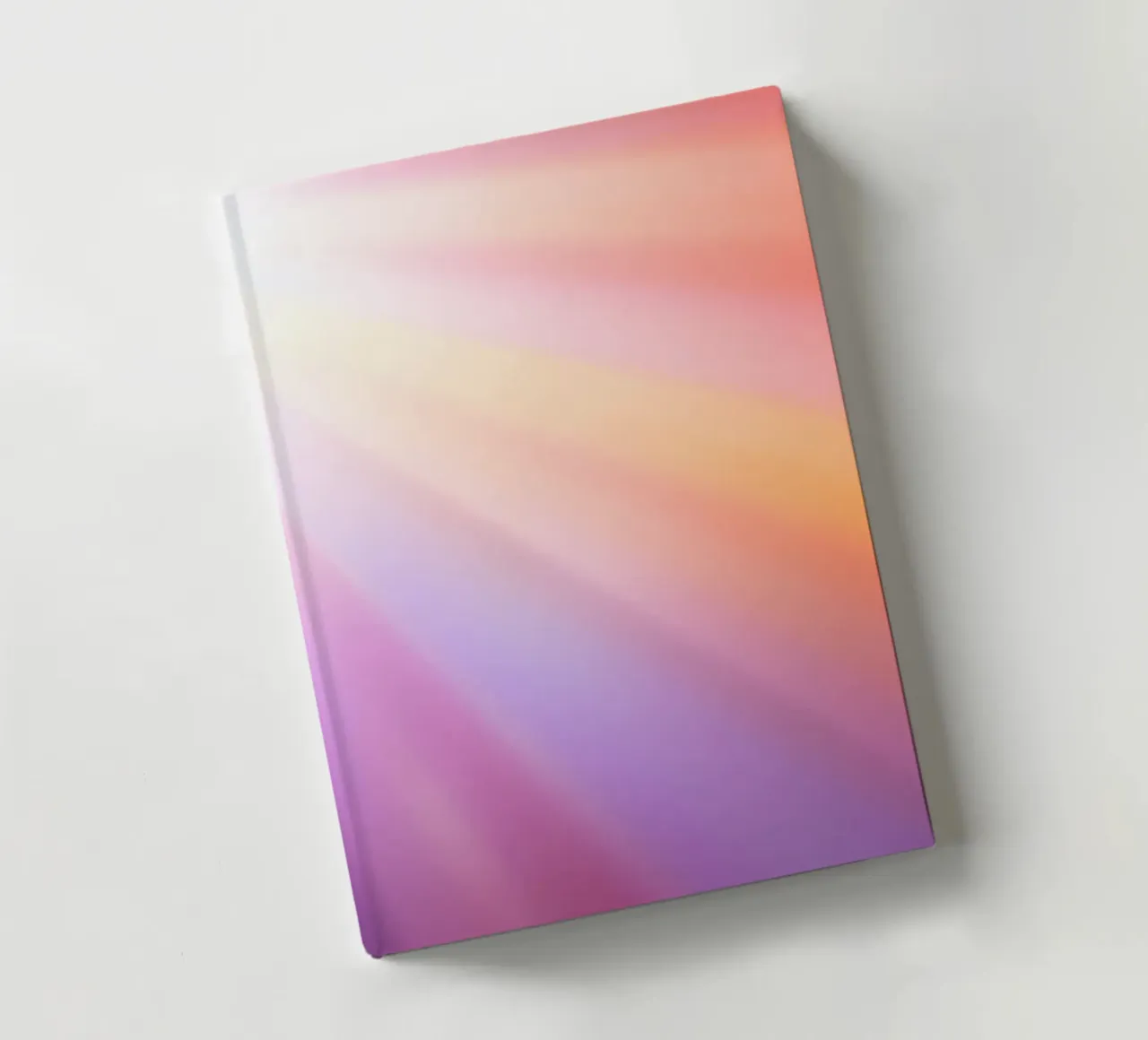 Bright rays of sunlight create a colorful gradient notebook by DesignDoodle