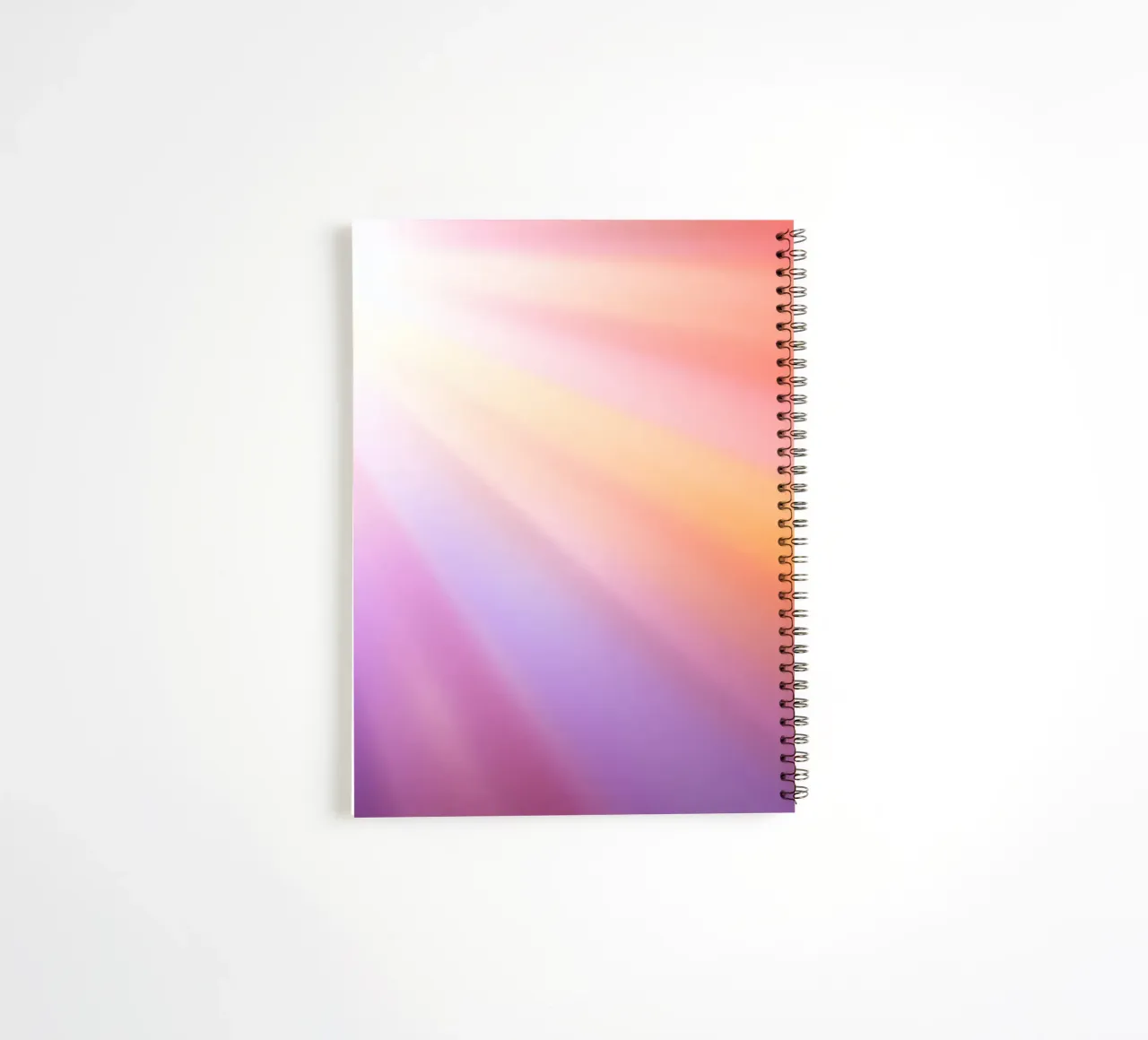 Bright rays of sunlight create a colorful gradient spiral notebook by DesignDoodle