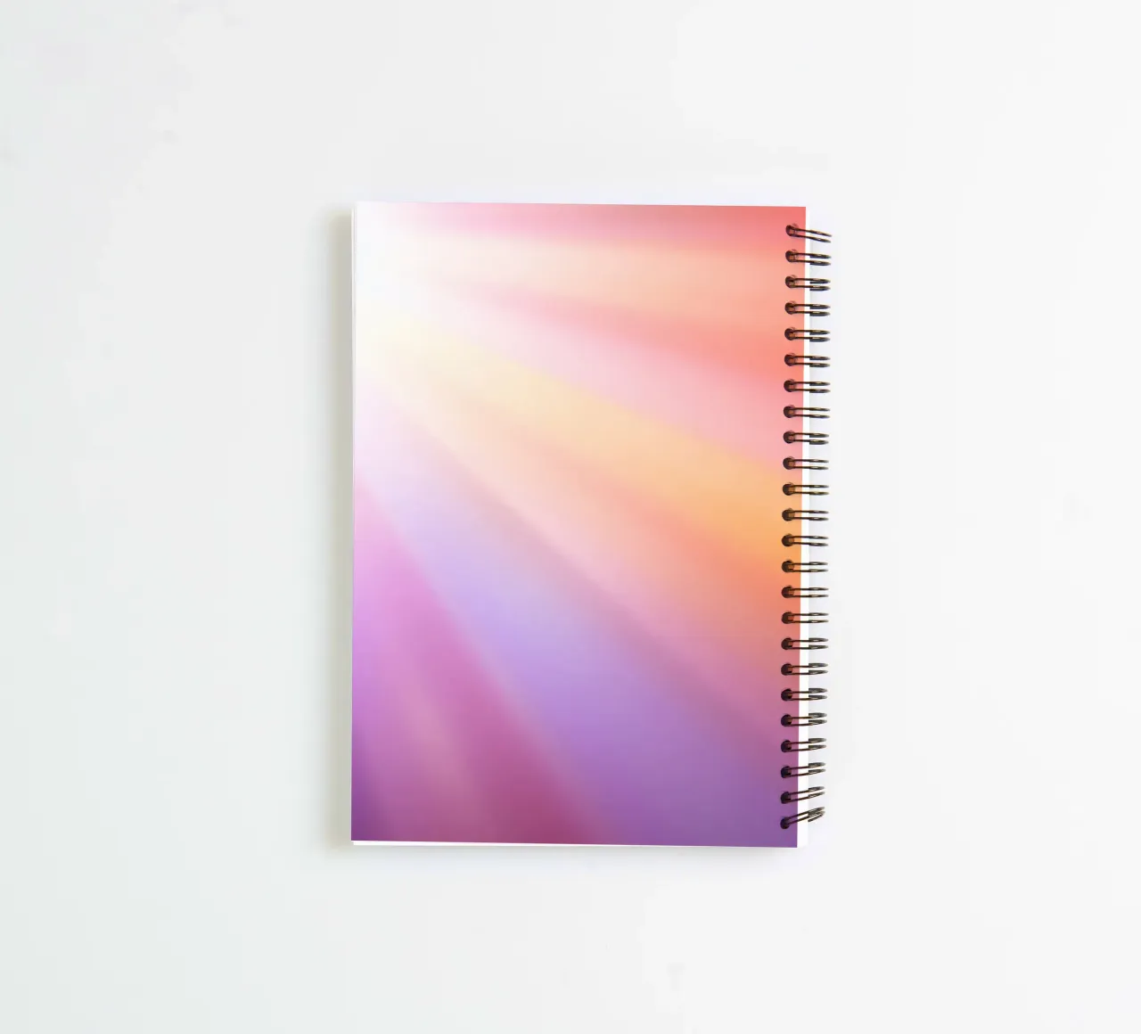Bright rays of sunlight create a colorful gradient spiral notebook by DesignDoodle