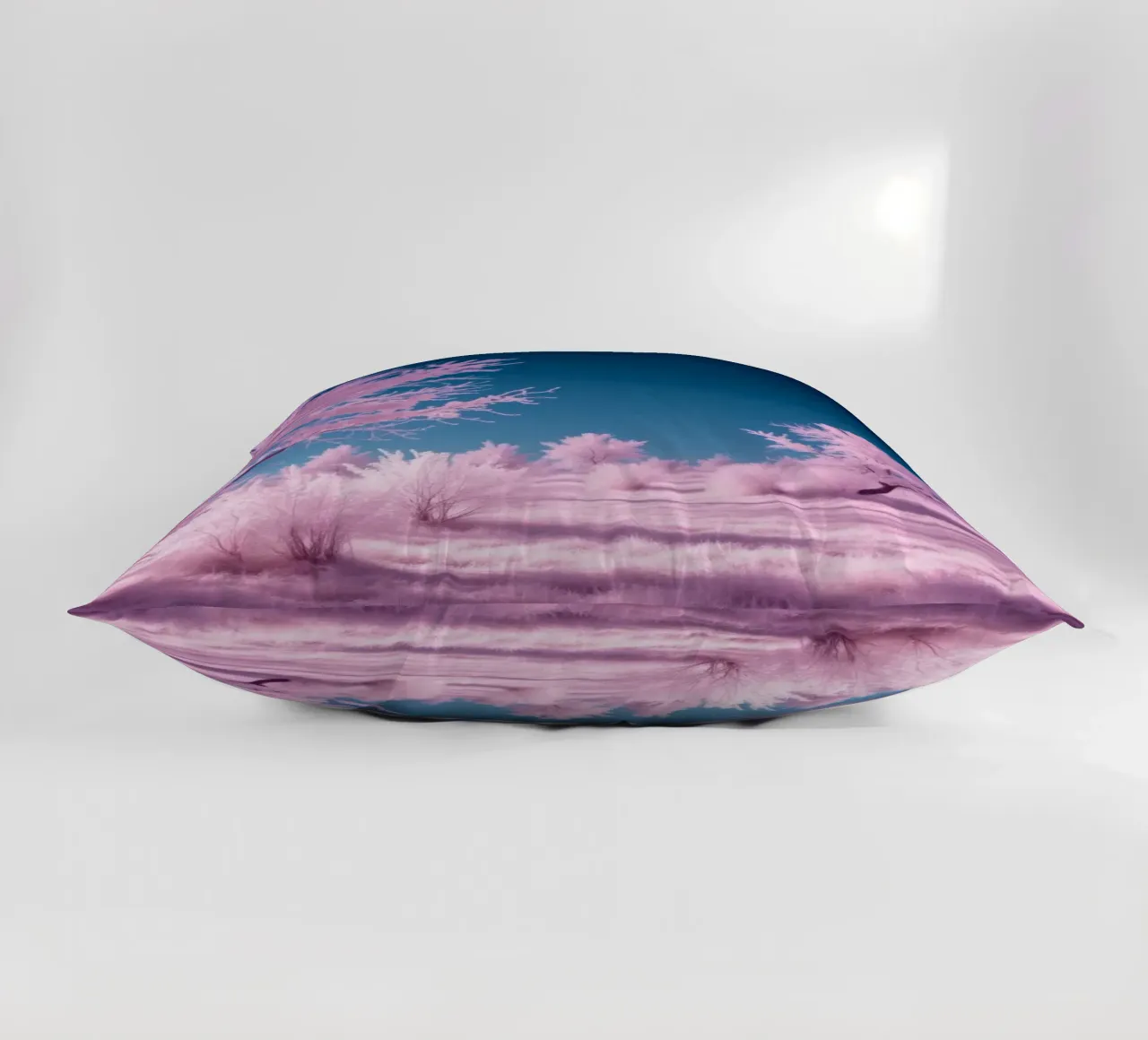 paesaggio invernale con alberi rosa e cielo azzurro cuscino da DesignDoodle