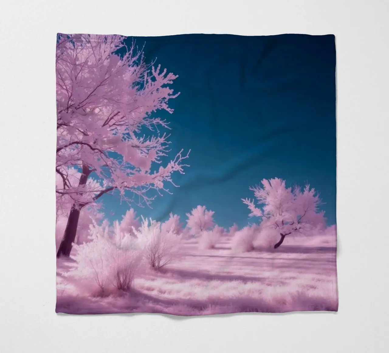 winter landscape with pink trees and clear blue sky fleece blanket by DesignDoodle