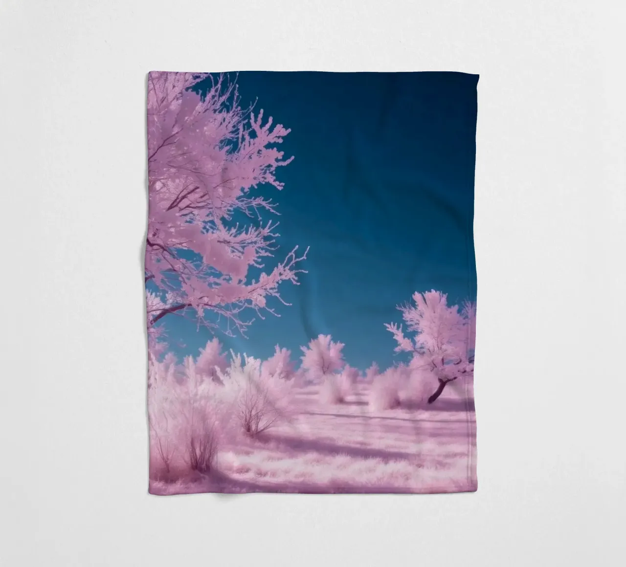 winter landscape with pink trees and clear blue sky fleece blanket by DesignDoodle