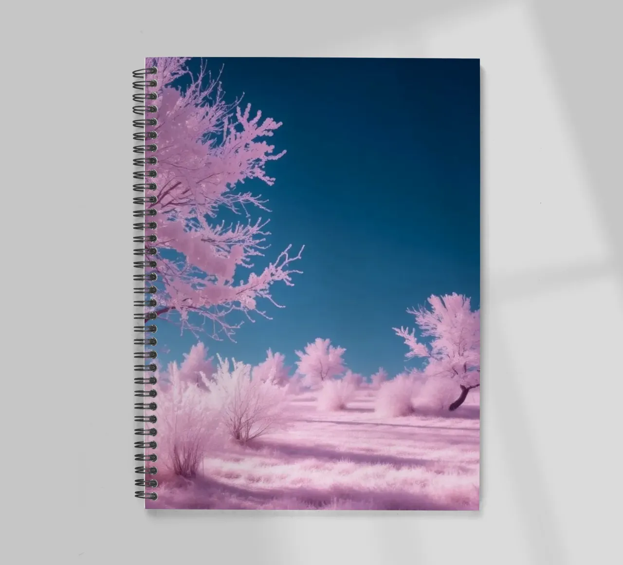 winter landscape with pink trees and clear blue sky spiral notebook by DesignDoodle