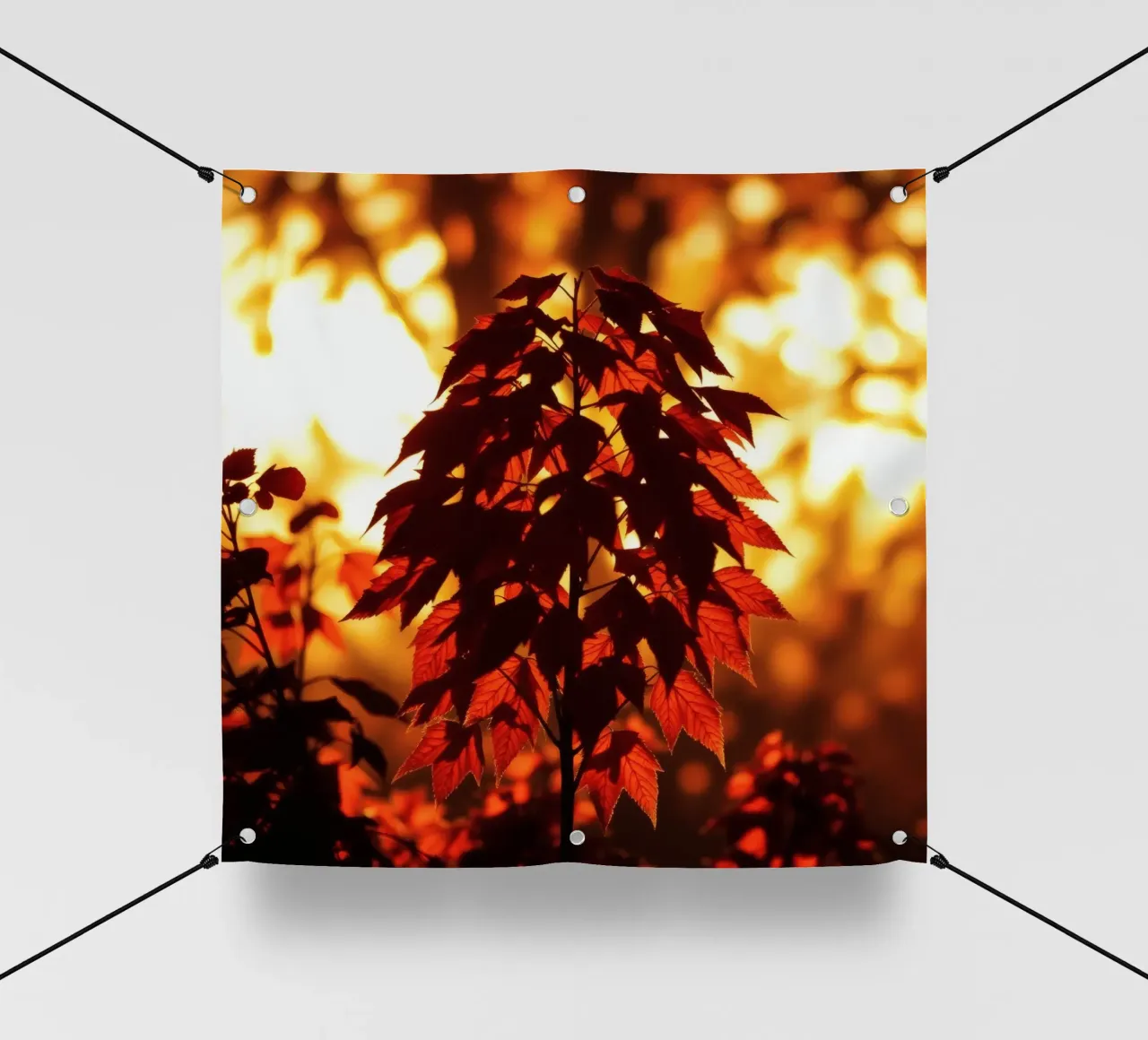 Silhouette di foglie autunnali contro un tramonto luminoso telo in pvc da DesignDoodle