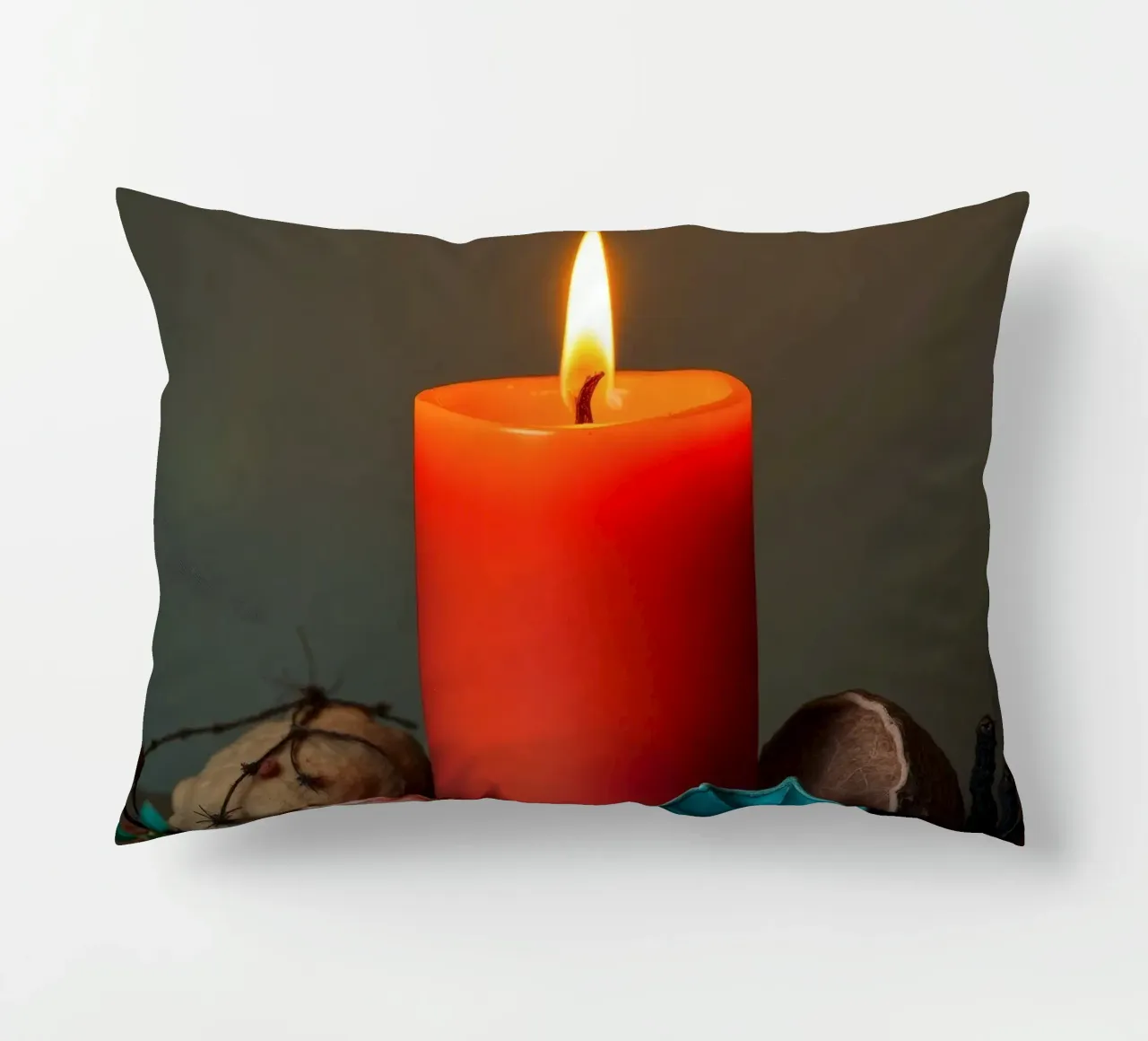 Bright orange candle surrounded by decorative stones decorative cushion by DesignDoodle