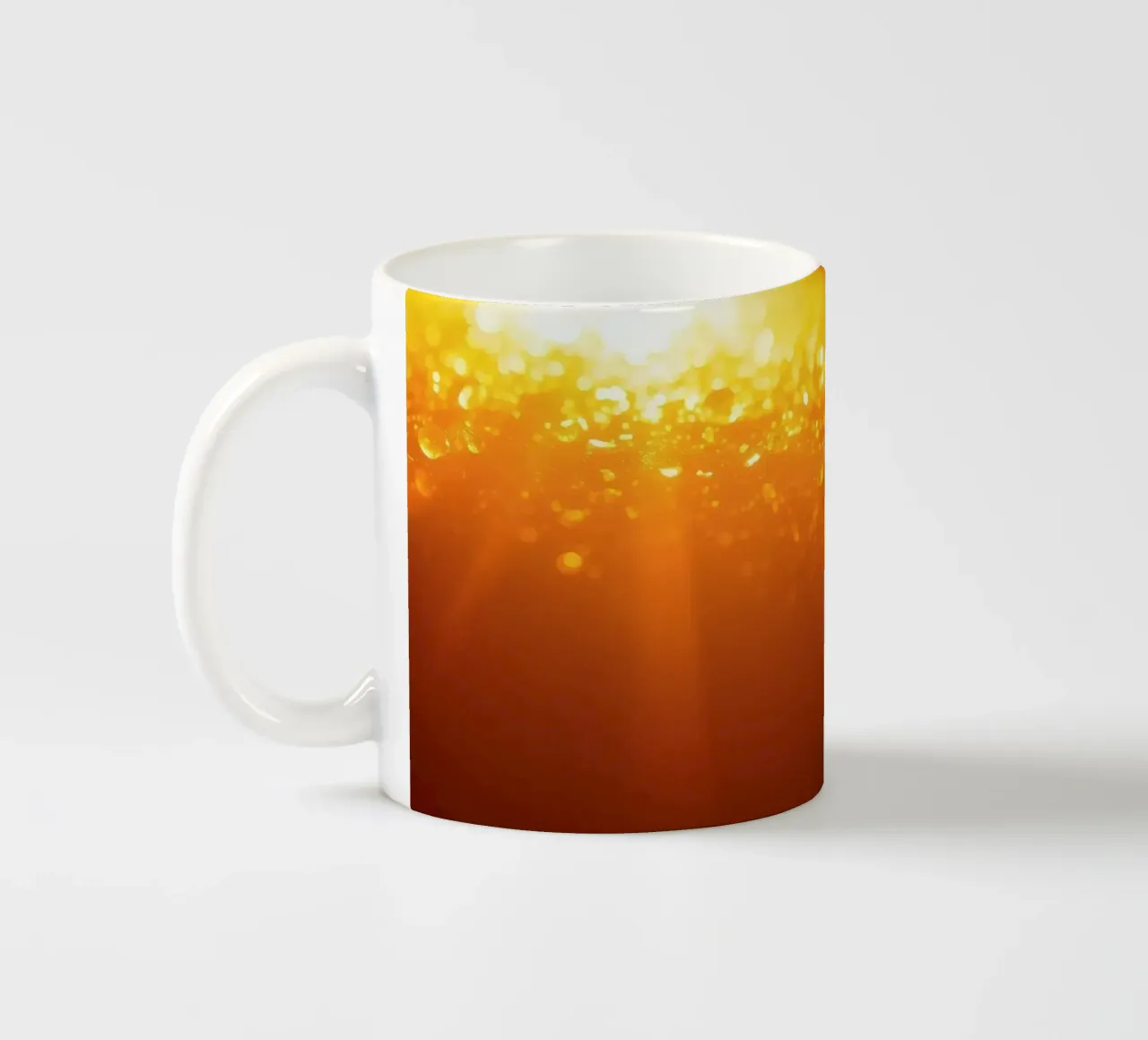 Sunlight glistens on a dewy surface at dawn, creating a warm ceramic mug by DesignDoodle
