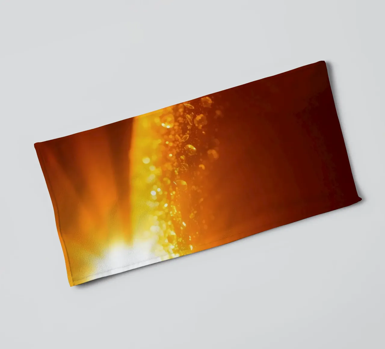 Sunlight glistens on a dewy surface at dawn, creating a warm towel by DesignDoodle