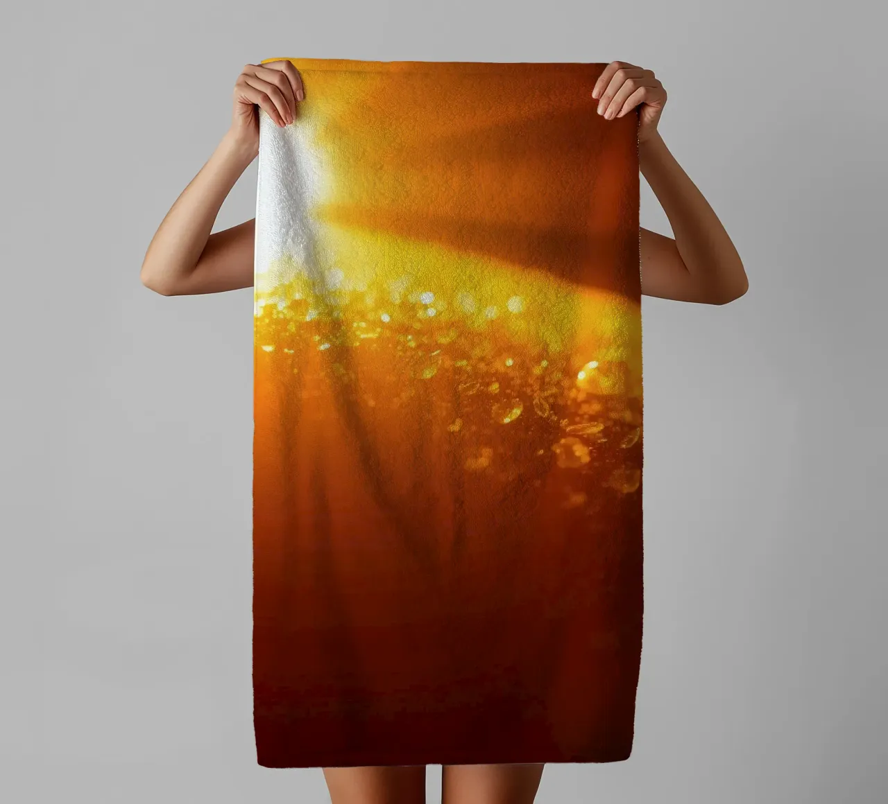 Sunlight glistens on a dewy surface at dawn, creating a warm towel by DesignDoodle