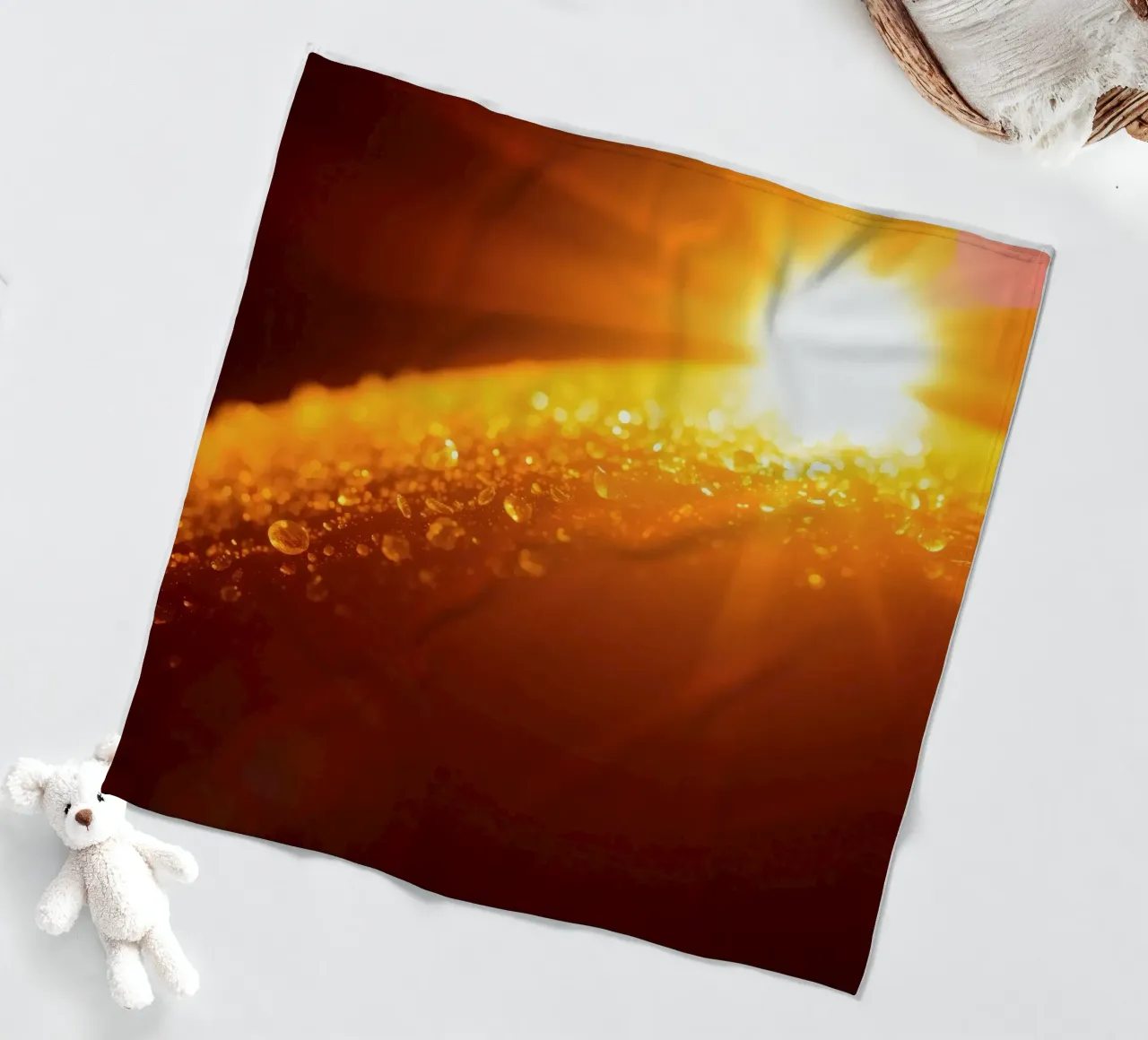 Sunlight glistens on a dewy surface at dawn, creating a warm fleece blanket by DesignDoodle