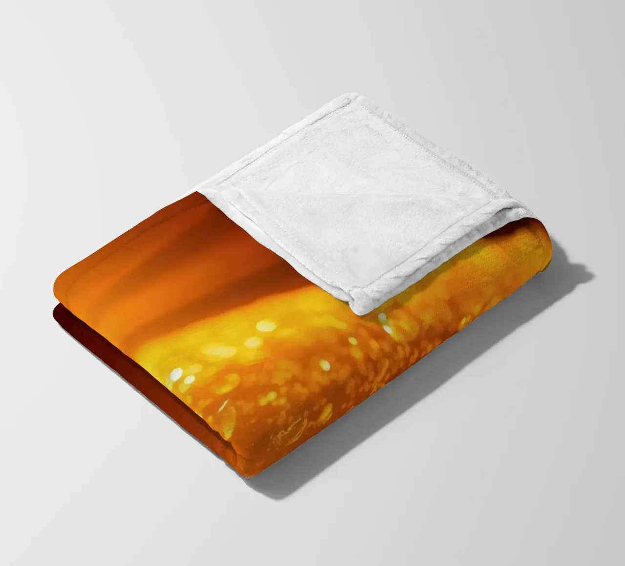 Sunlight glistens on a dewy surface at dawn, creating a warm fleece blanket by DesignDoodle