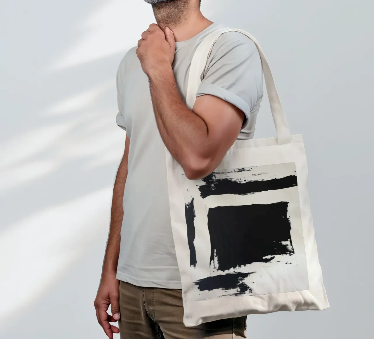 Abstract black and white artwork featuring bold brush stroke tote bag by DesignDoodle