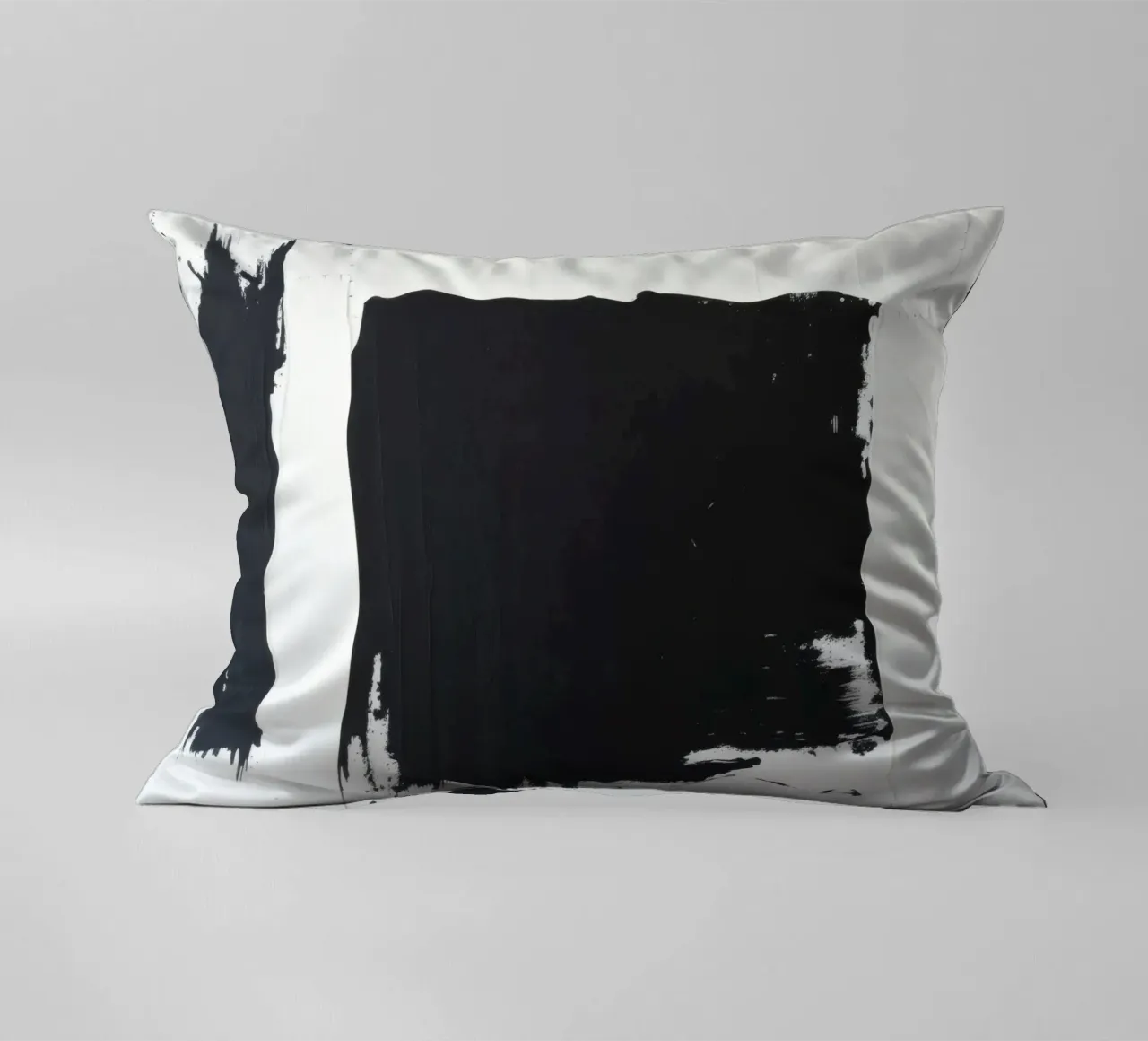 Abstract black and white artwork featuring bold brush stroke decorative cushion by DesignDoodle