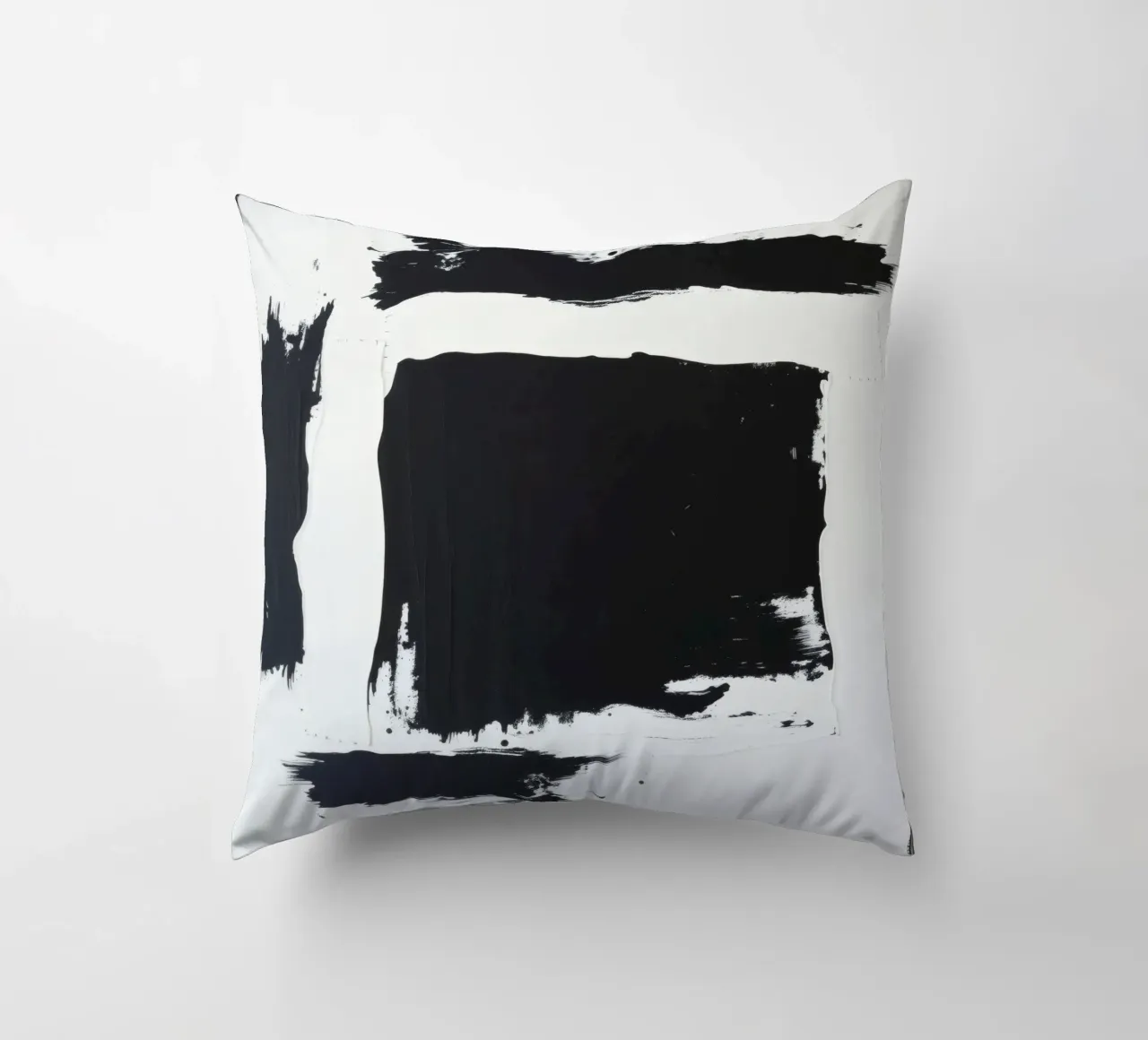 Abstract black and white artwork featuring bold brush stroke decorative cushion by DesignDoodle