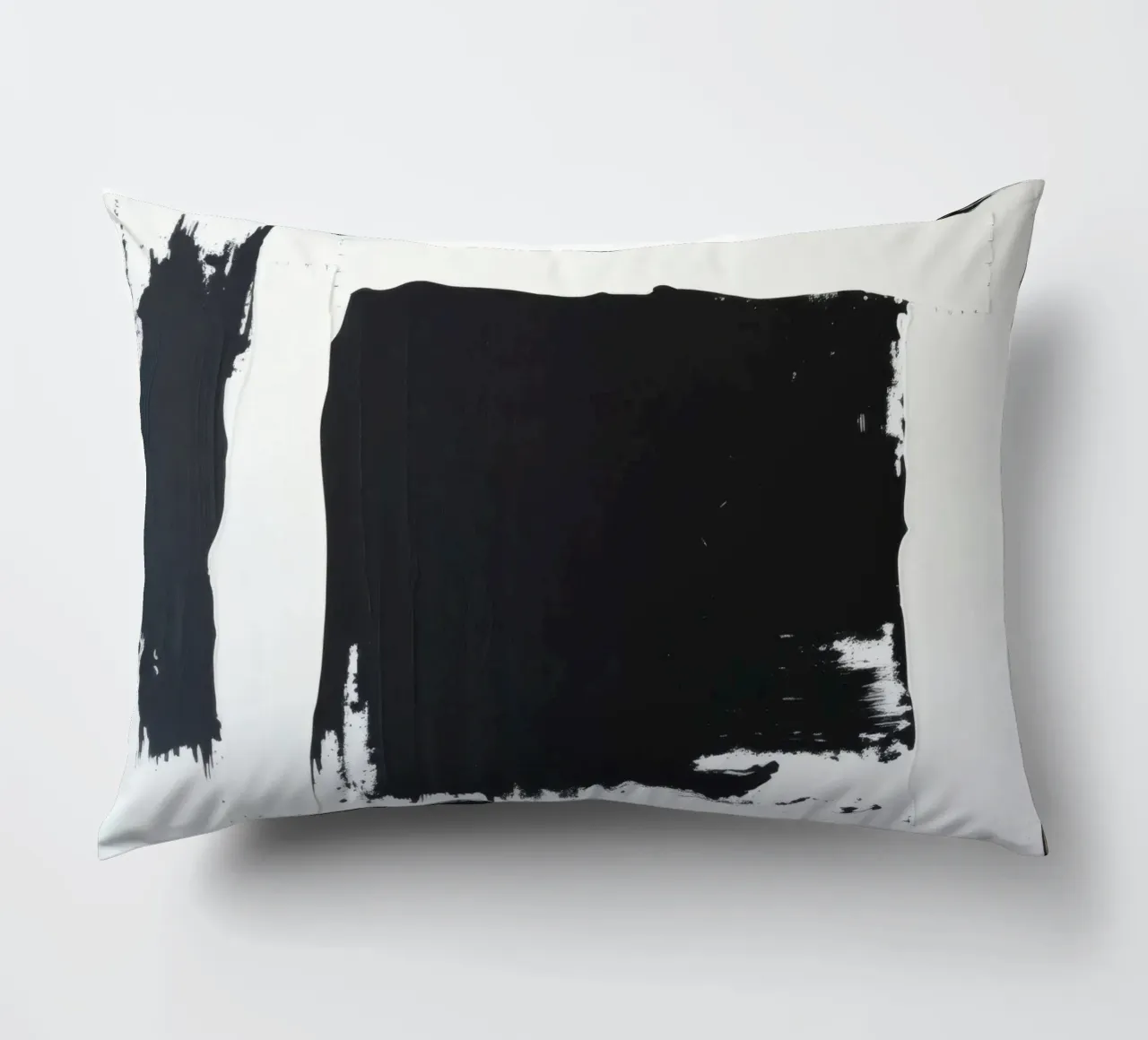 Abstract black and white artwork featuring bold brush stroke decorative cushion by DesignDoodle