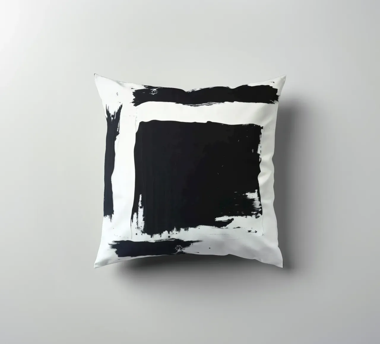 Abstract black and white artwork featuring bold brush stroke decorative cushion by DesignDoodle