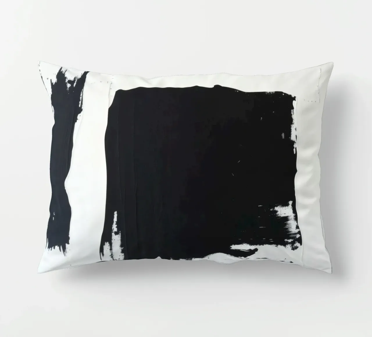 Abstract black and white artwork featuring bold brush stroke decorative cushion by DesignDoodle