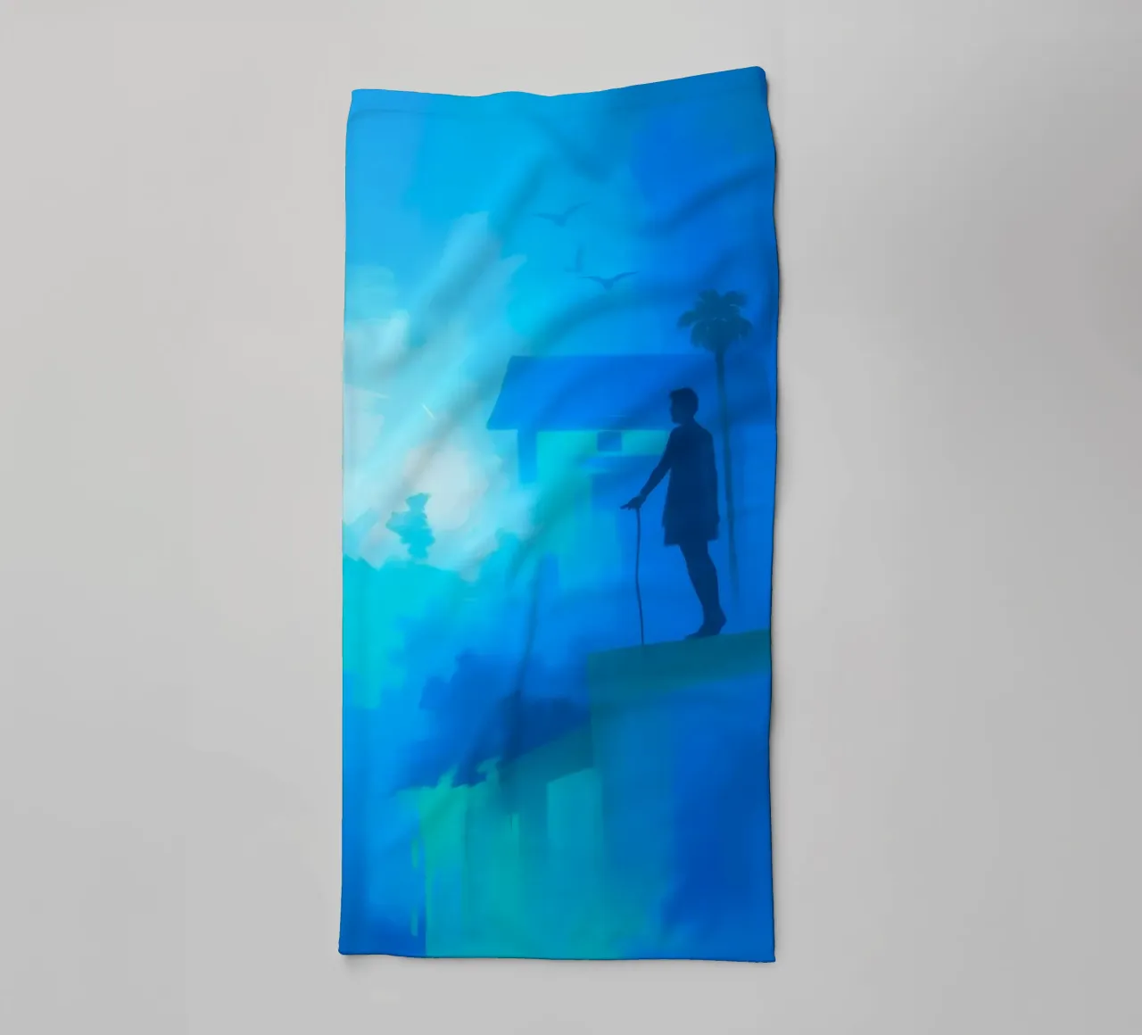 Solo figure stands on a cliff, gazing into a misty landscape towel by DesignDoodle