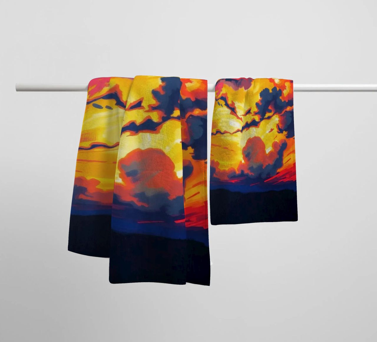 Vivid sunset landscape with dramatic clouds illuminating towel by DesignDoodle