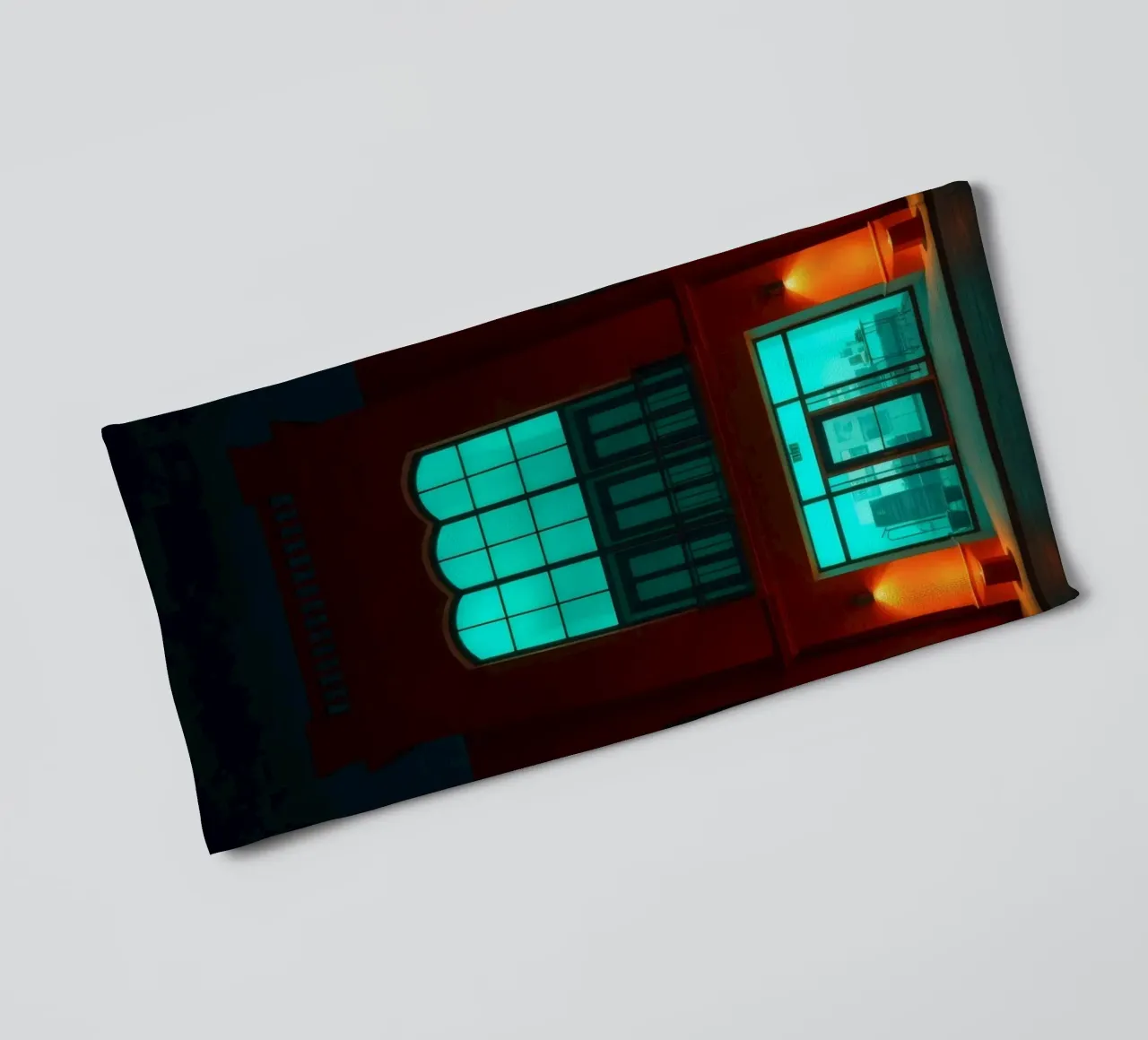 Brightly illuminated building with blue-green windows towel by DesignDoodle
