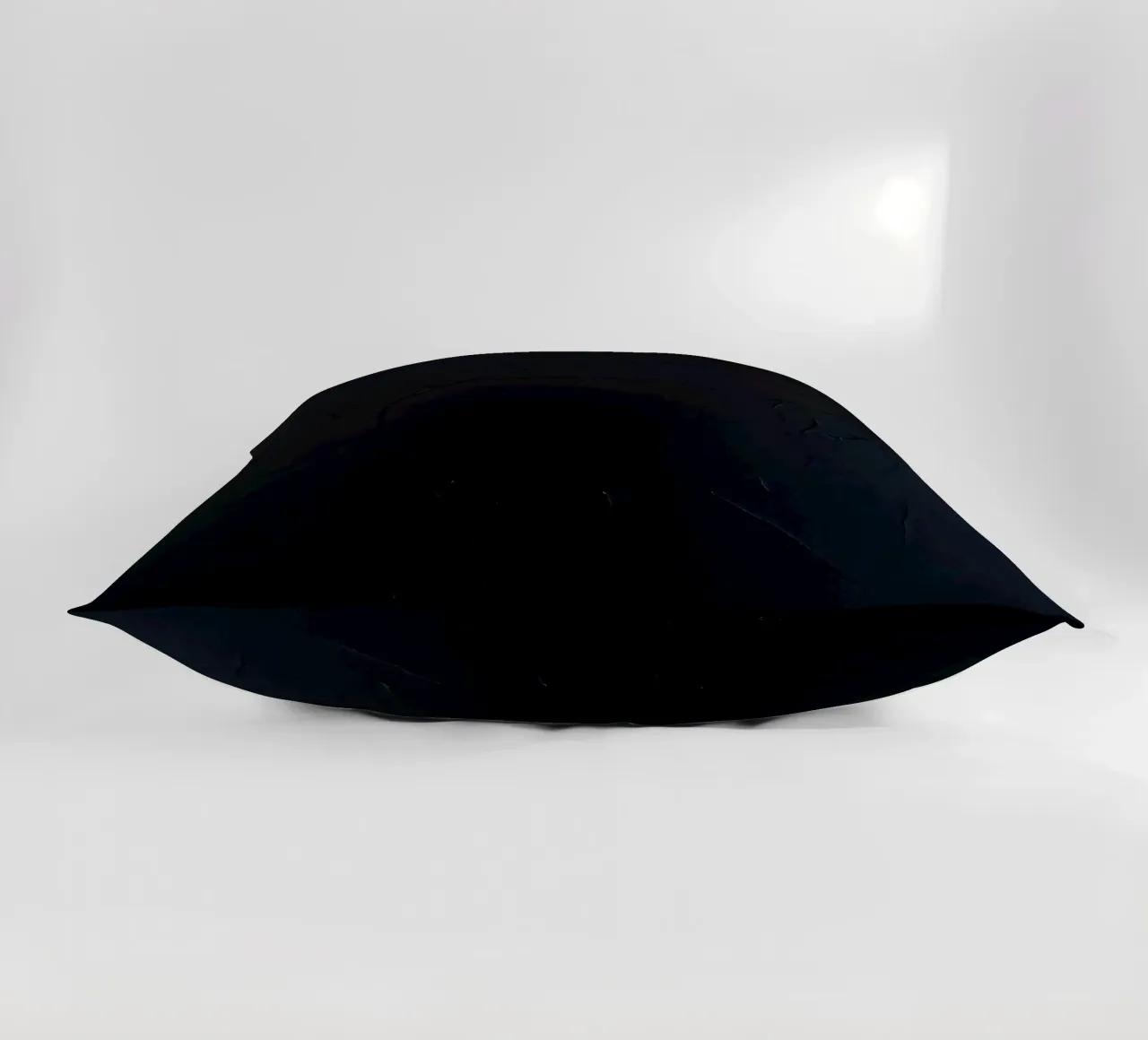 Dark textured surface with subtle variations in hues decorative cushion by DesignDoodle